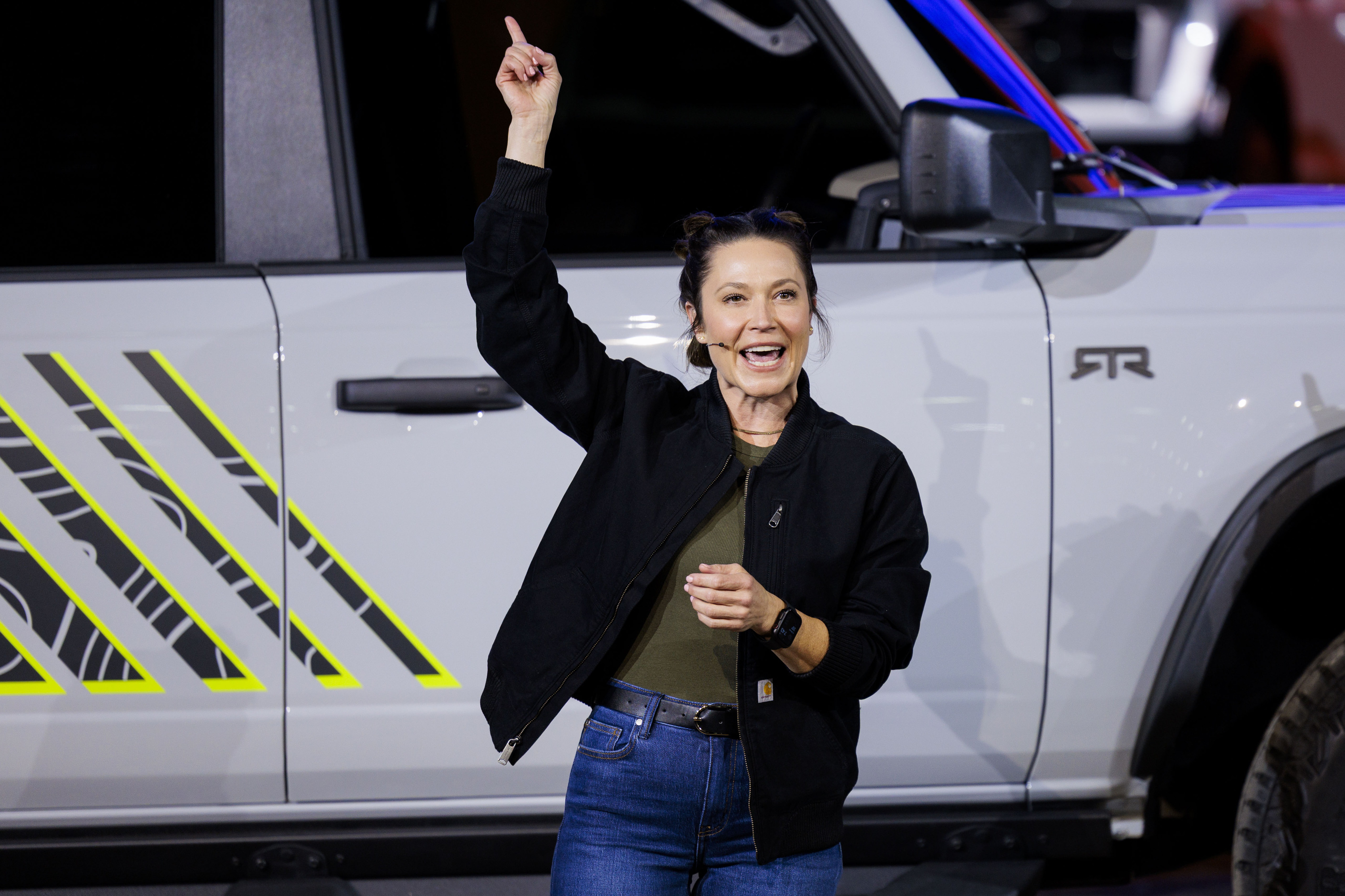 Off-road racer Shelby Hall in front of the new Ford Bronco RTR during a Ford Motor Company event ahead of the Detroit Auto Show at Huntinton Place in Detroit on Tuesday, Jan. 13 2026.