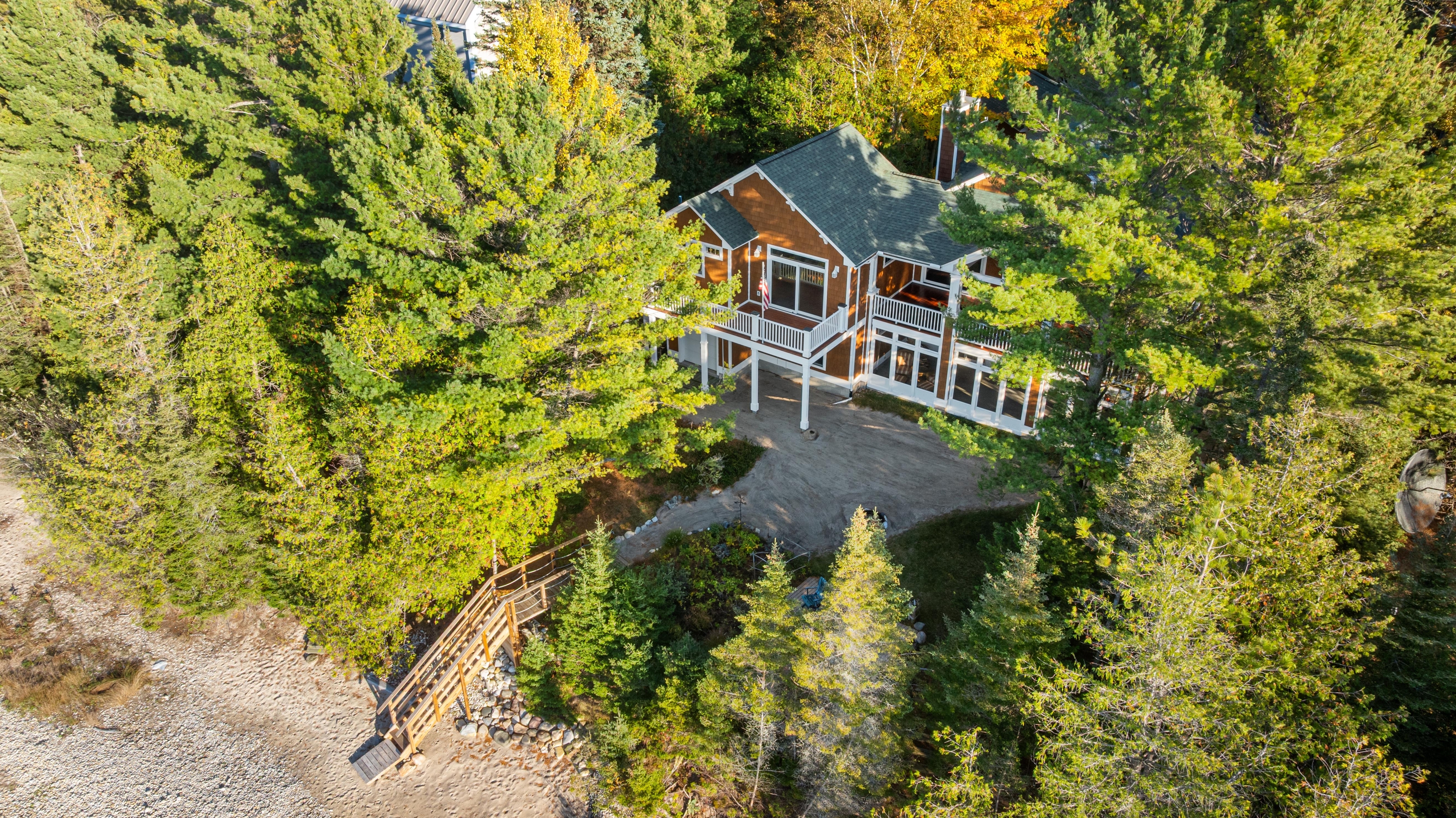 Aerial photographs of 4093 Lake Shore Drive in Charlevoix, this gem is listed at $2,099,900 through Berkshire Hathaway HomeServices Michigan Real Estate – Traverse City and The Crane Group with associate broker Johnny Crane and his brother, co-listing agent Matt Crane.