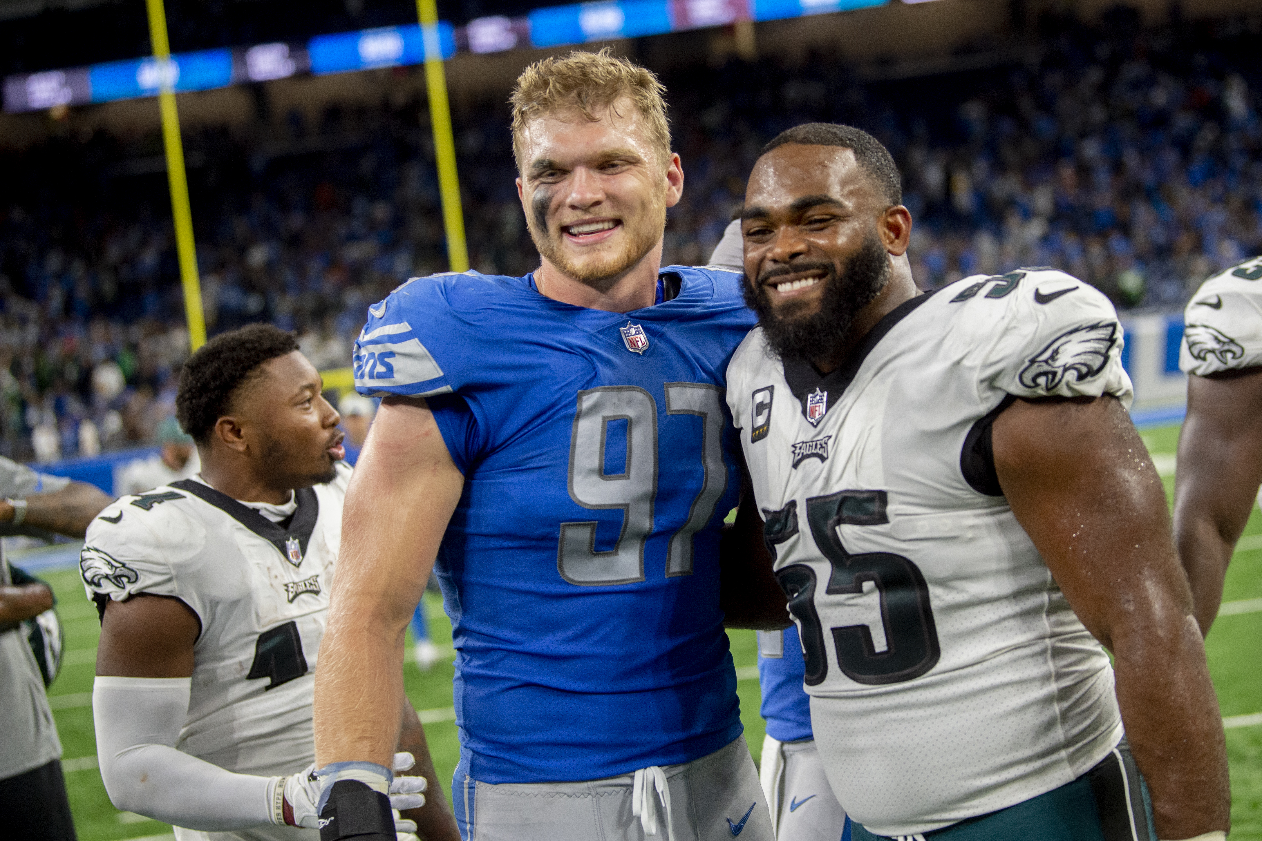 Jamaal Williams, Aidan Hutchinson, and Frank Ragnow meet with the