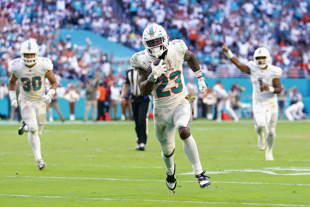 Cleveland Browns running back Nick Chubb (24) and Miami Dolphins wide  receiver Tyreek Hill (10) exchange jerseys at the end of an NFL football  game, Sunday, Nov. 13, 2022, in Miami Gardens