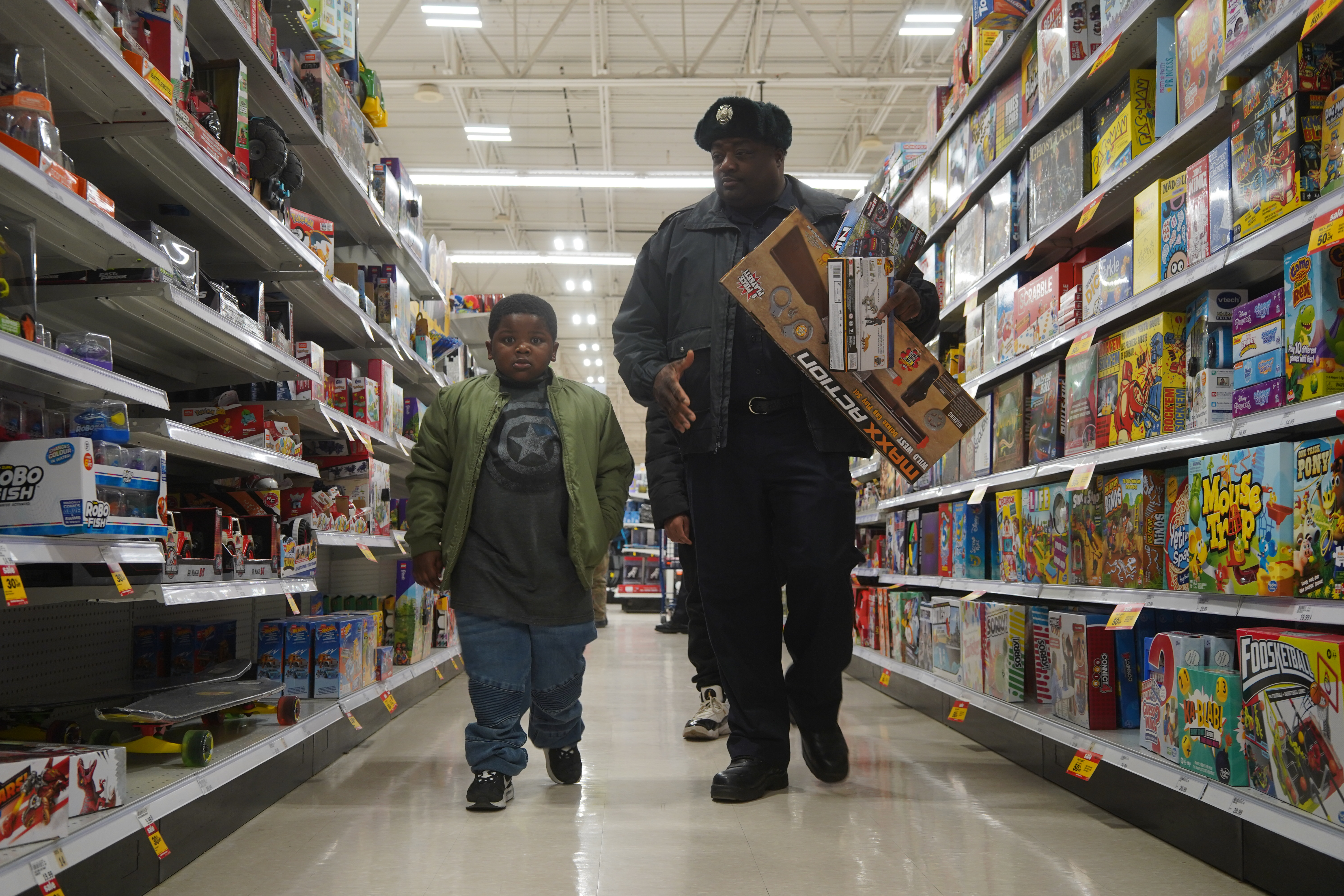 Police firefighters team with Burton Meijer for Shop with a Hero