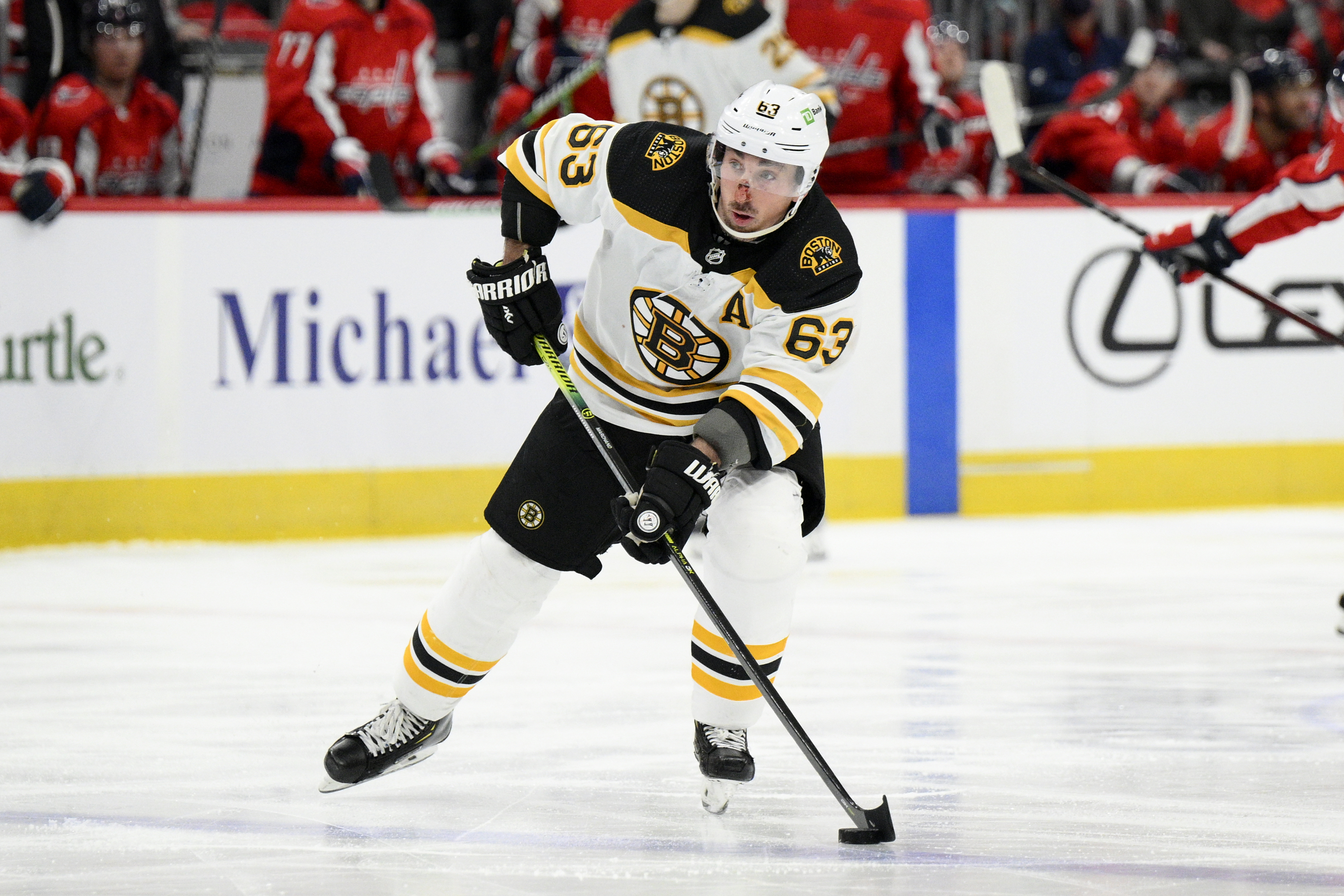 NHL referee takes out Bruins' Brad Marchand with surprise check in bizarre  moment