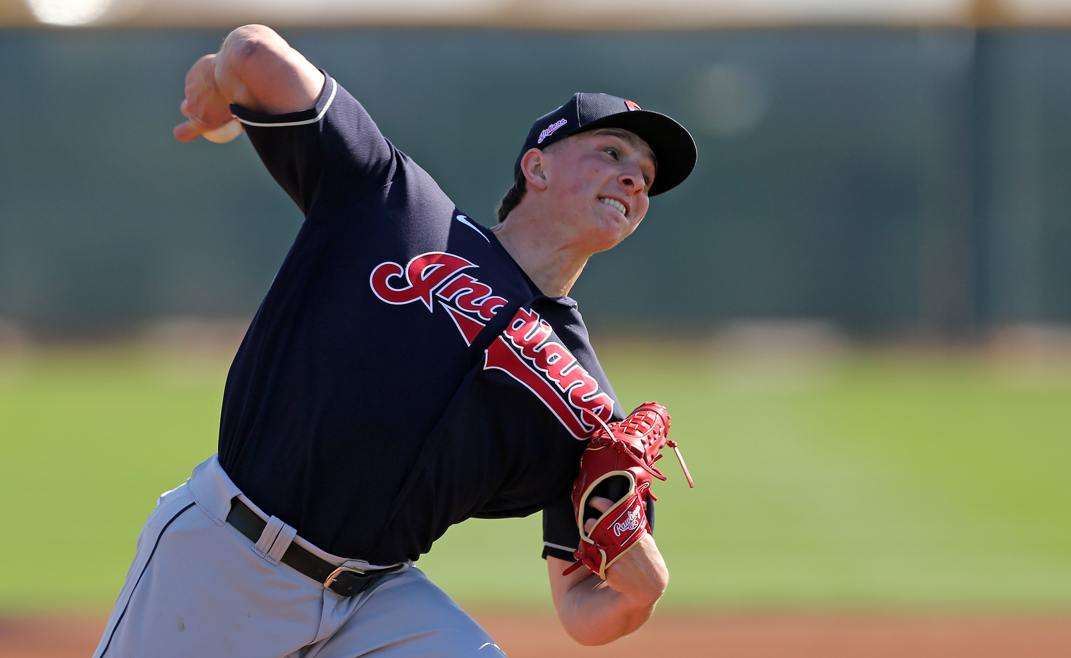 Cleveland Indians relief pitcher James Karinchak air high fives manager  Terry Francona after the game agai…