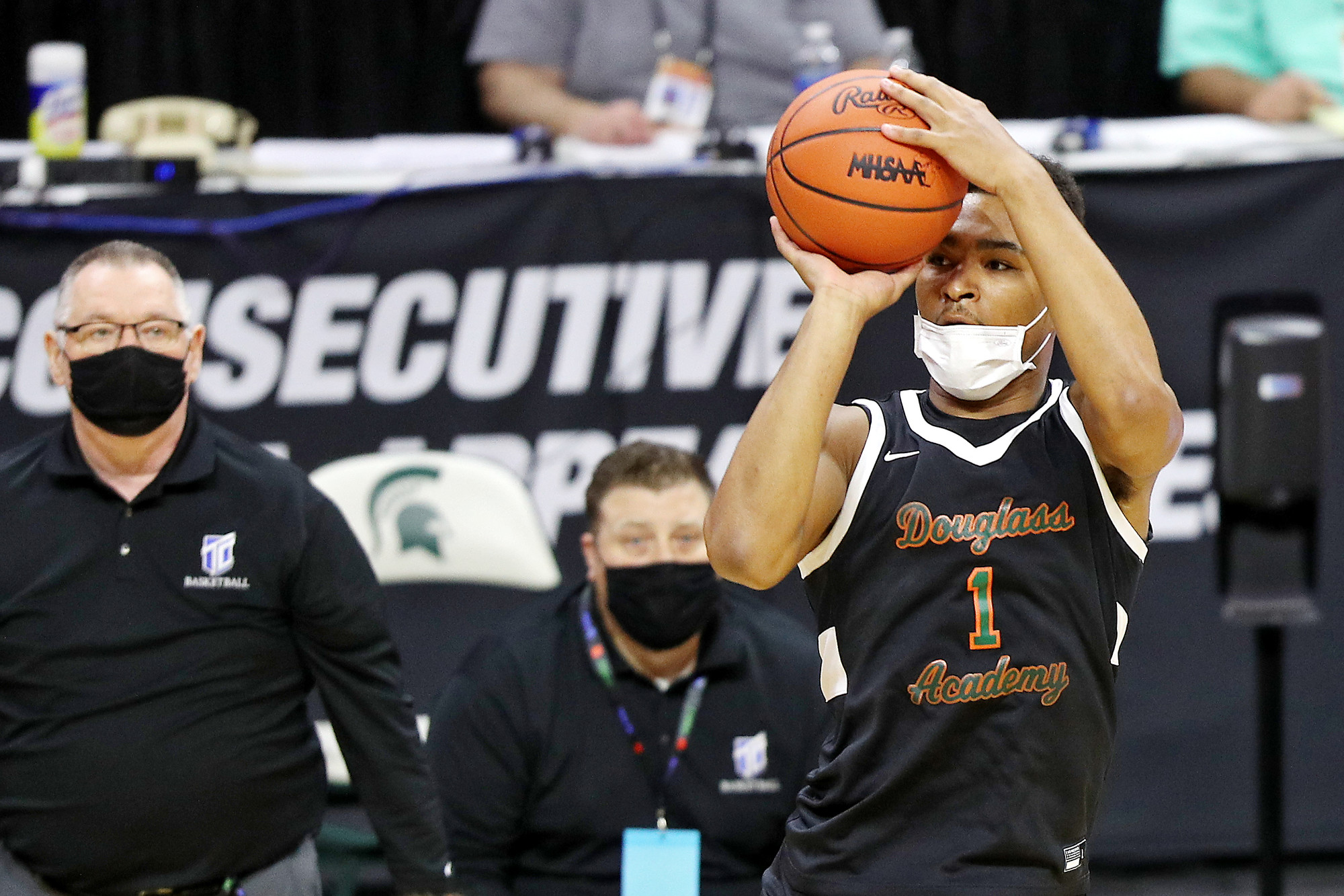 Photos of Detroit Douglass basketball player Pierre Brooks II