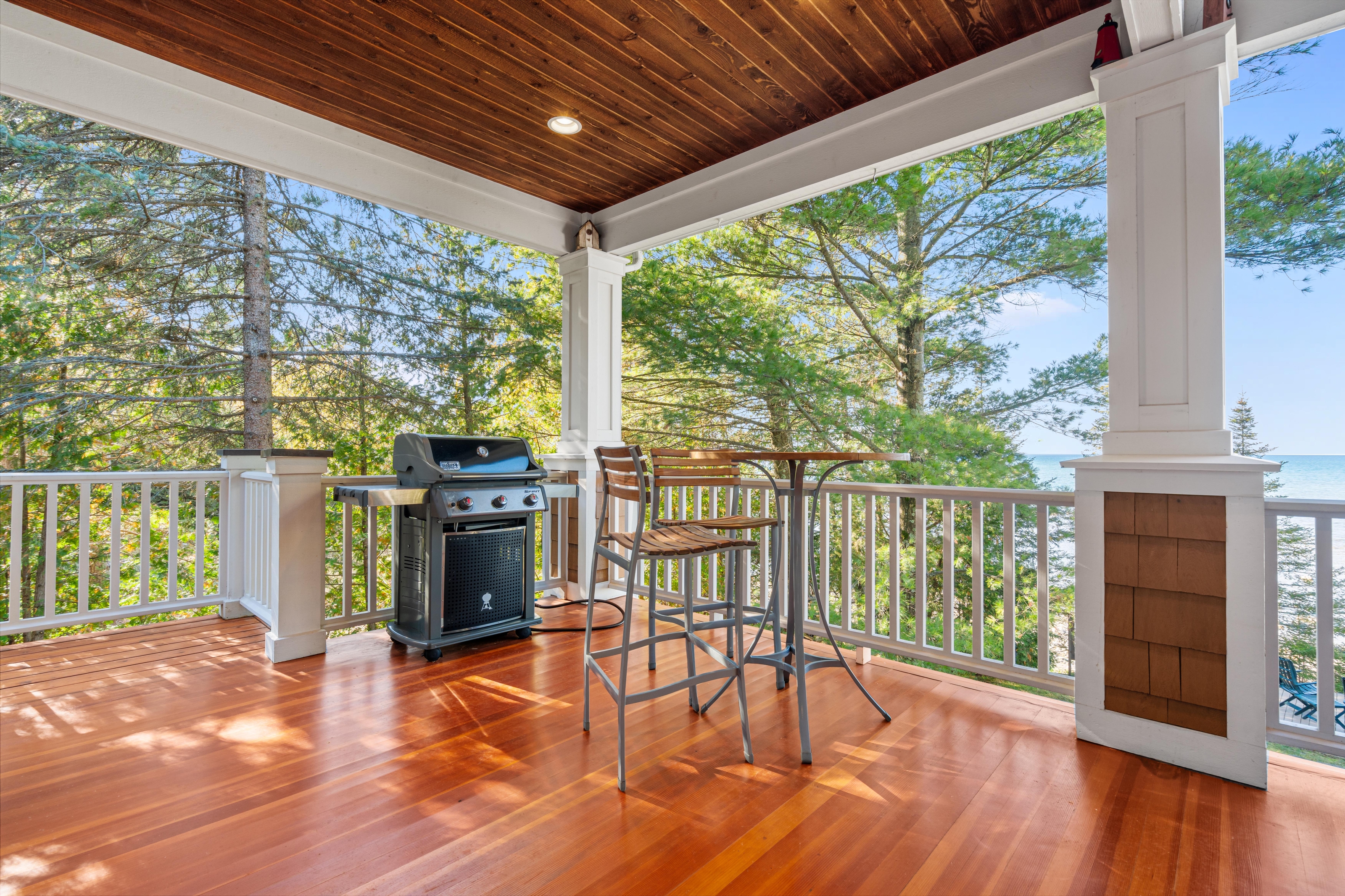 Exterior photographs of 4093 Lake Shore Drive in Charlevoix, this gem is listed at $2,099,900 through Berkshire Hathaway HomeServices Michigan Real Estate – Traverse City and The Crane Group with associate broker Johnny Crane and his brother, co-listing agent Matt Crane.