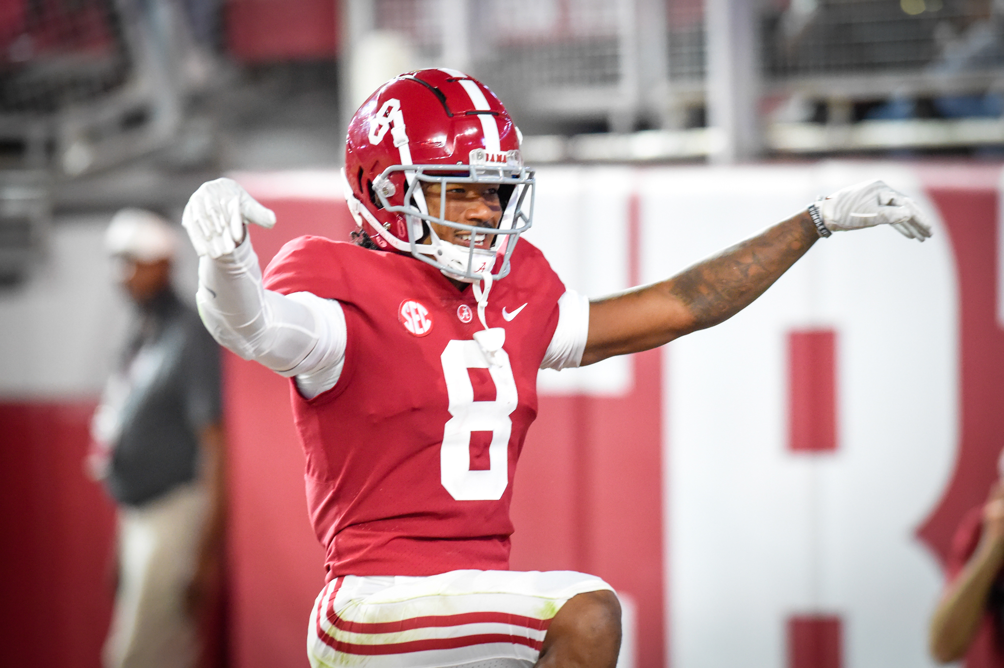 Alabama center Chris Owens (79), receiver John Metchie III (8