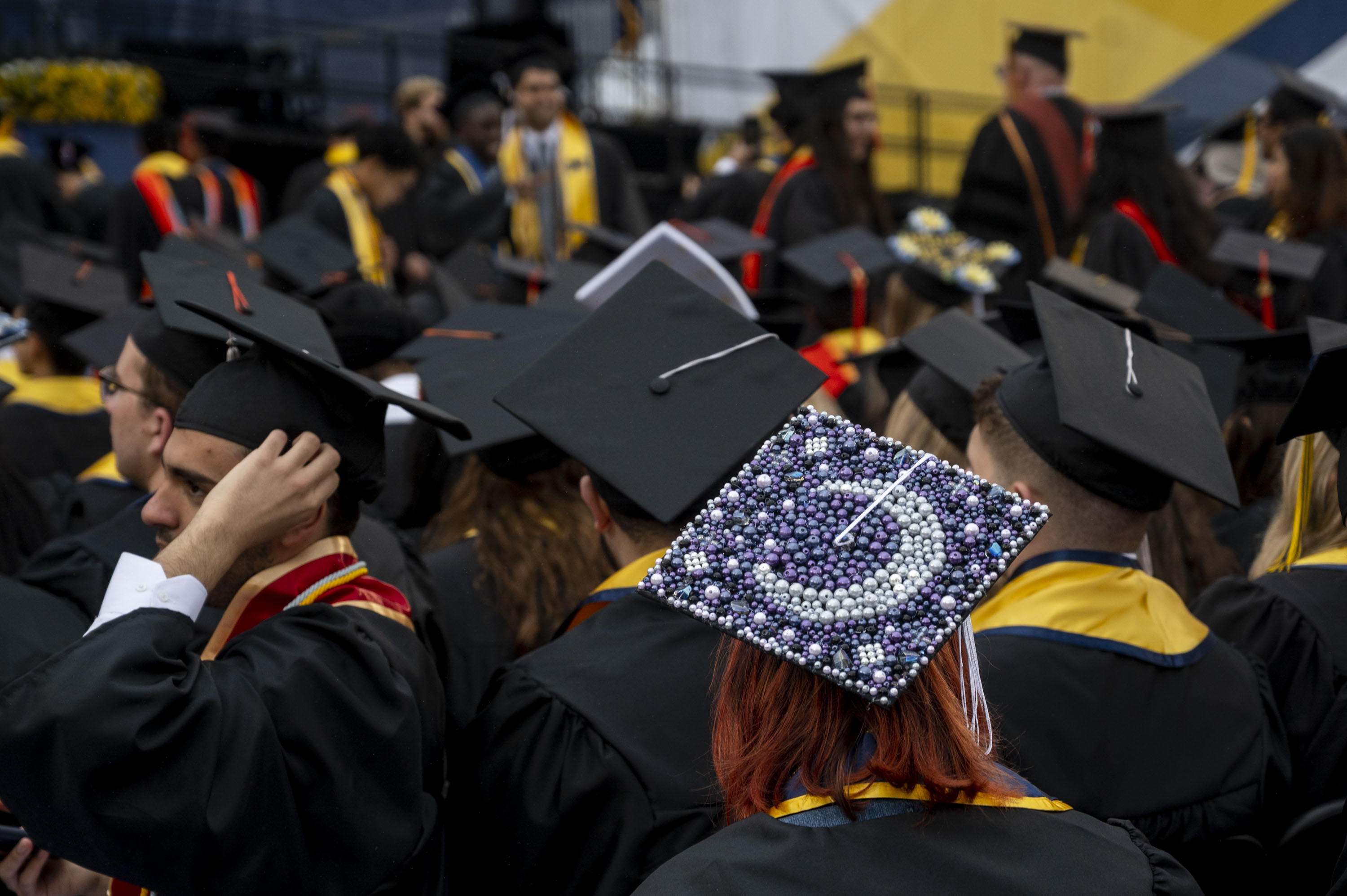 50 decorated caps from University of Michigan Spring Commencement