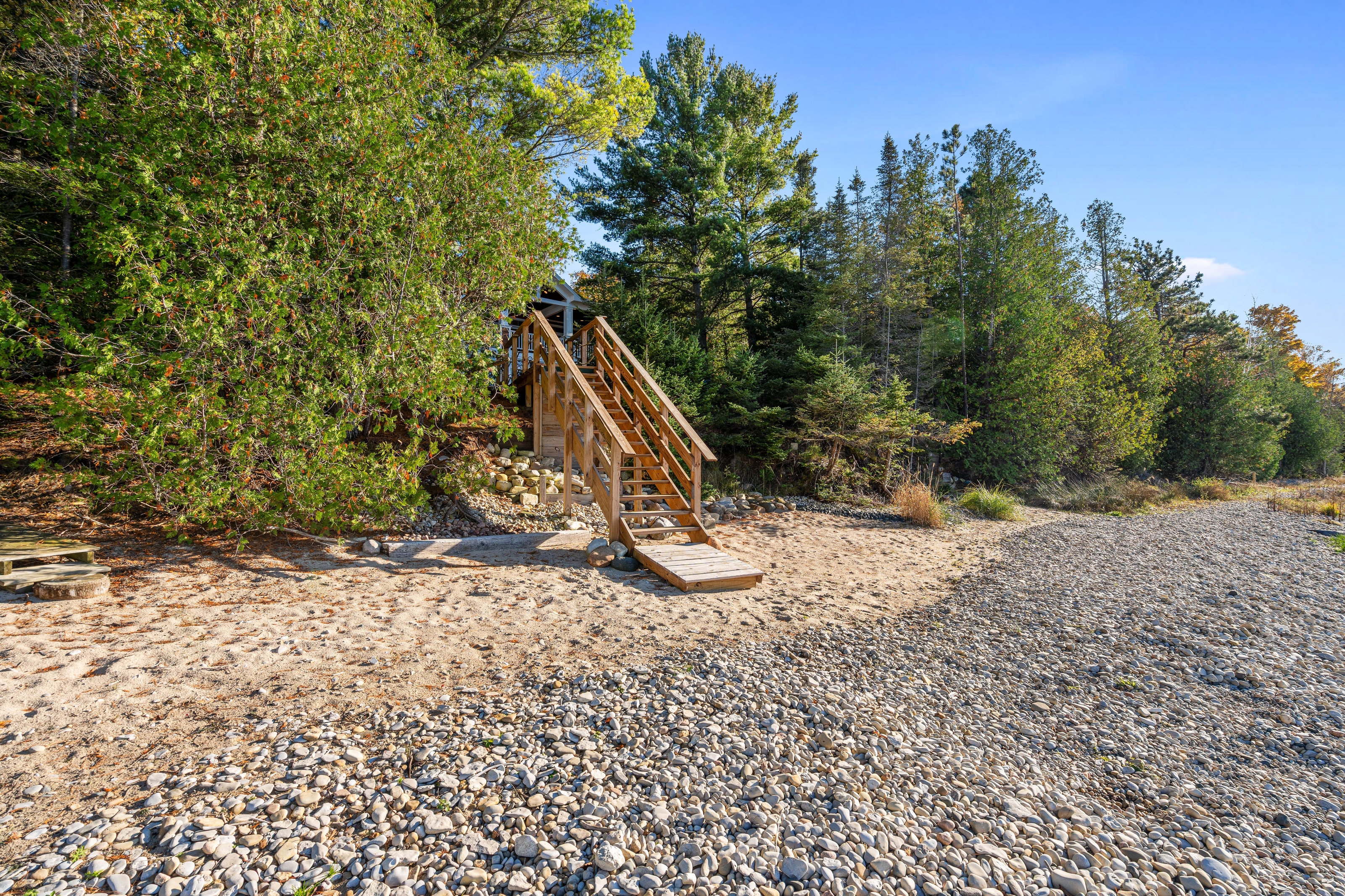 Exterior photographs of 4093 Lake Shore Drive in Charlevoix, this gem is listed at $2,099,900 through Berkshire Hathaway HomeServices Michigan Real Estate – Traverse City and The Crane Group with associate broker Johnny Crane and his brother, co-listing agent Matt Crane.