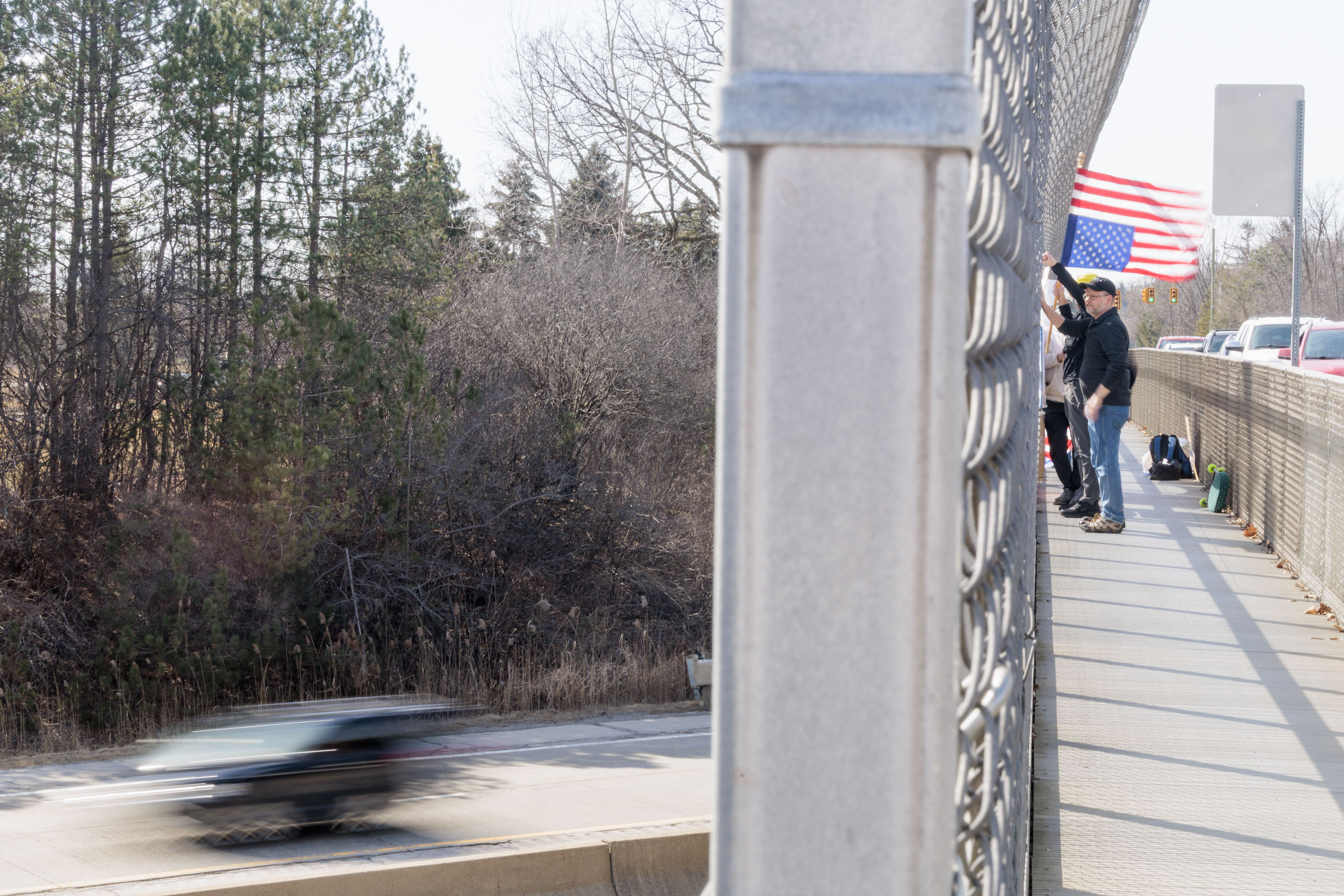 Demonstrators protest Trump Administration on four Ann Arbor pedestrian ...