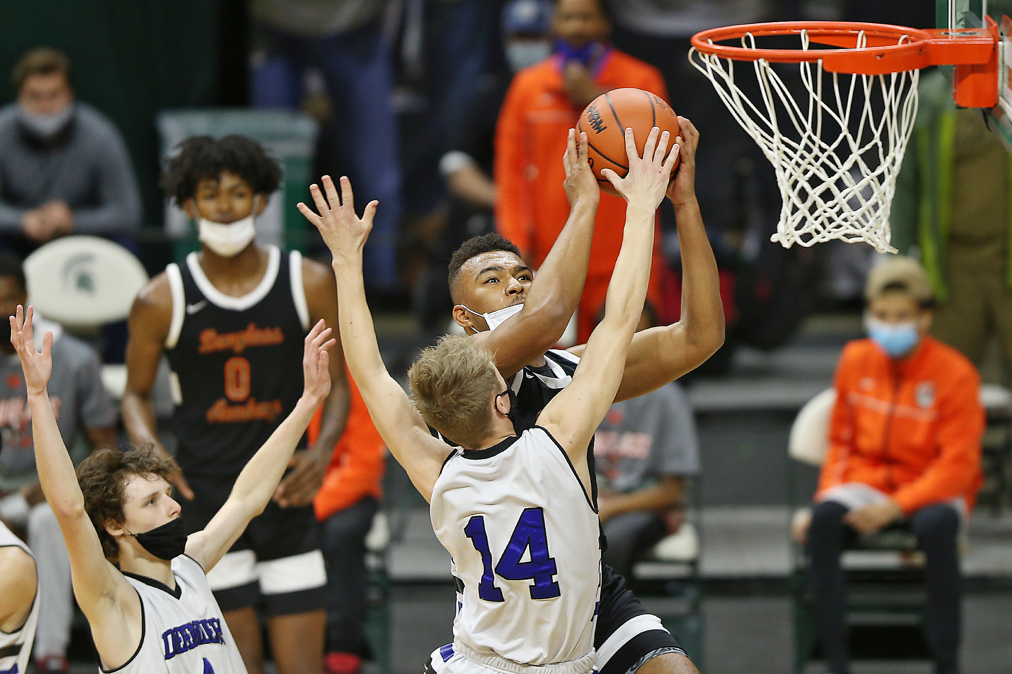 Photos of Detroit Douglass basketball player Pierre Brooks II