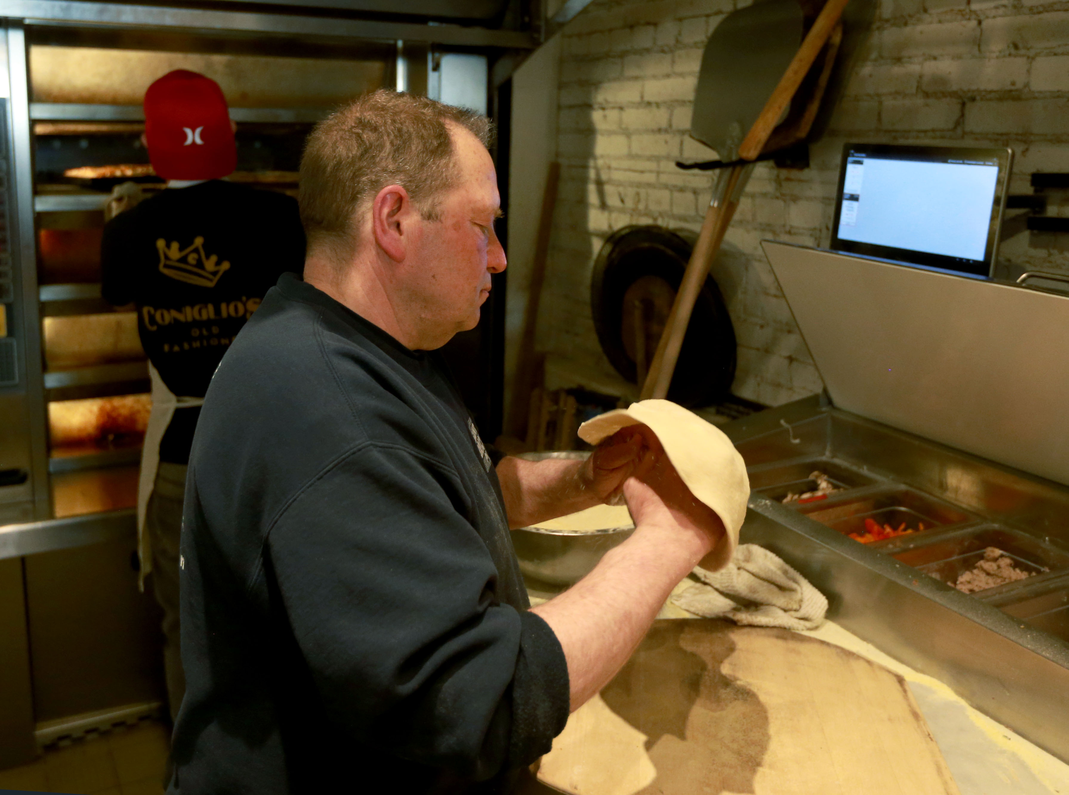 Pizza maker Al Santillo is making pizza at Coniglio’s as his place is ...