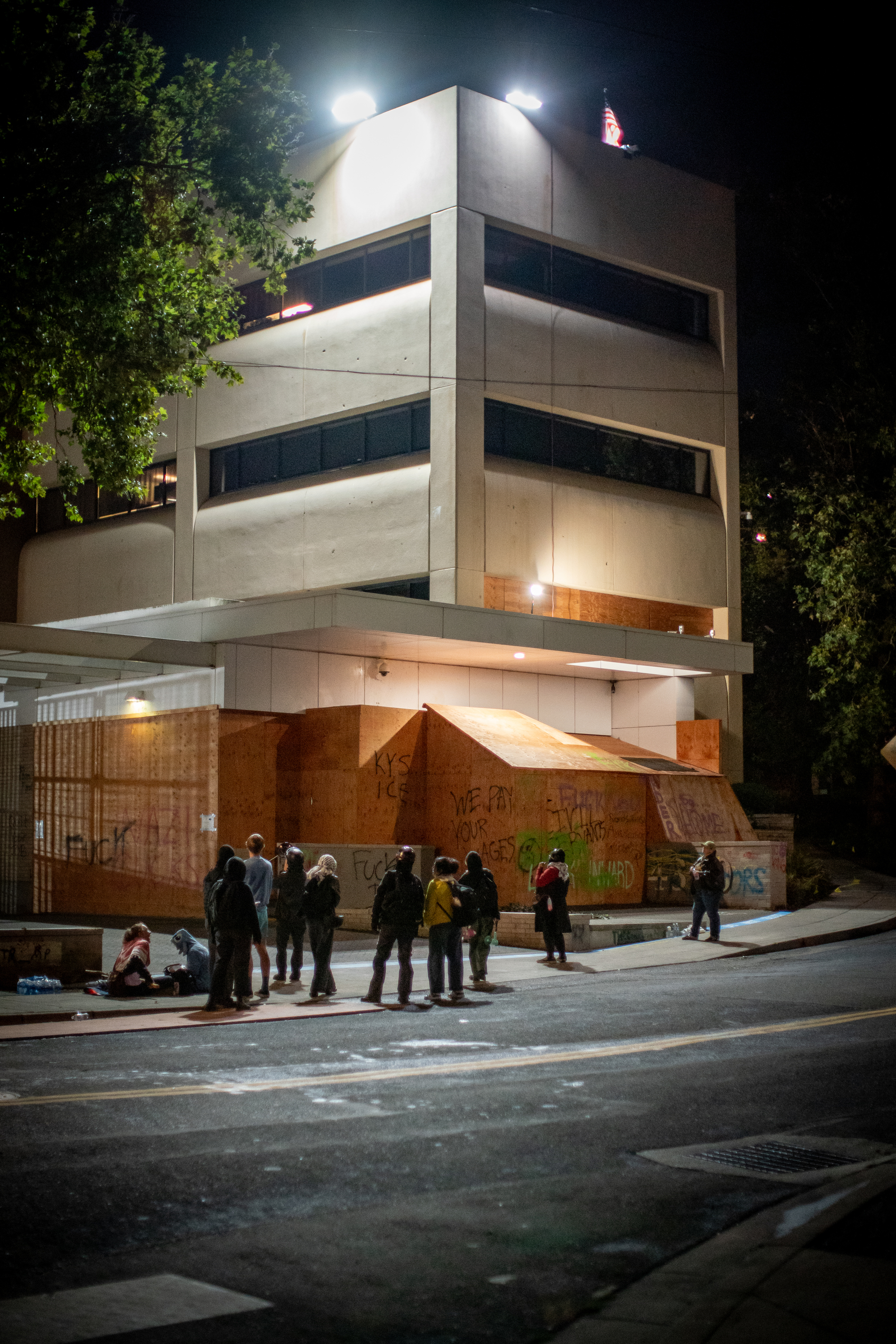 Protesters gather outside the boarded-up U.S. Immigration and Customs Enforcement building in South Portland on Monday, Sept. 8, 2025, days after President Donald Trump suggested federal intervention.