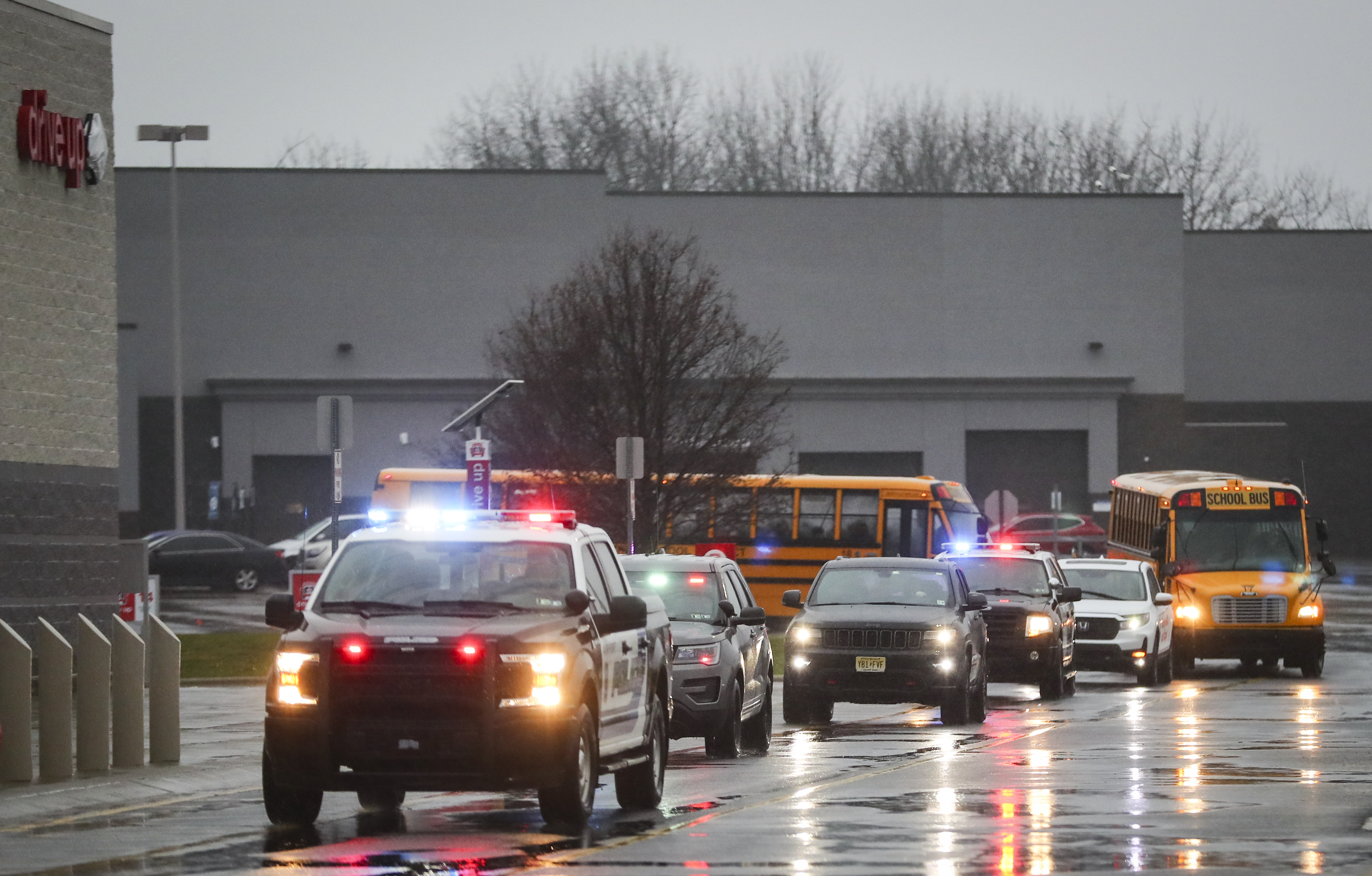 Officers with the Lehigh-Northampton Airport Authority Police Department give a police escort to 22 children and their families from the Catasauqua Area School District as they arrive at Target in Hanover Township, Lehigh County, Saturday, Dec. 3, 2022, for a shopping spree. 
