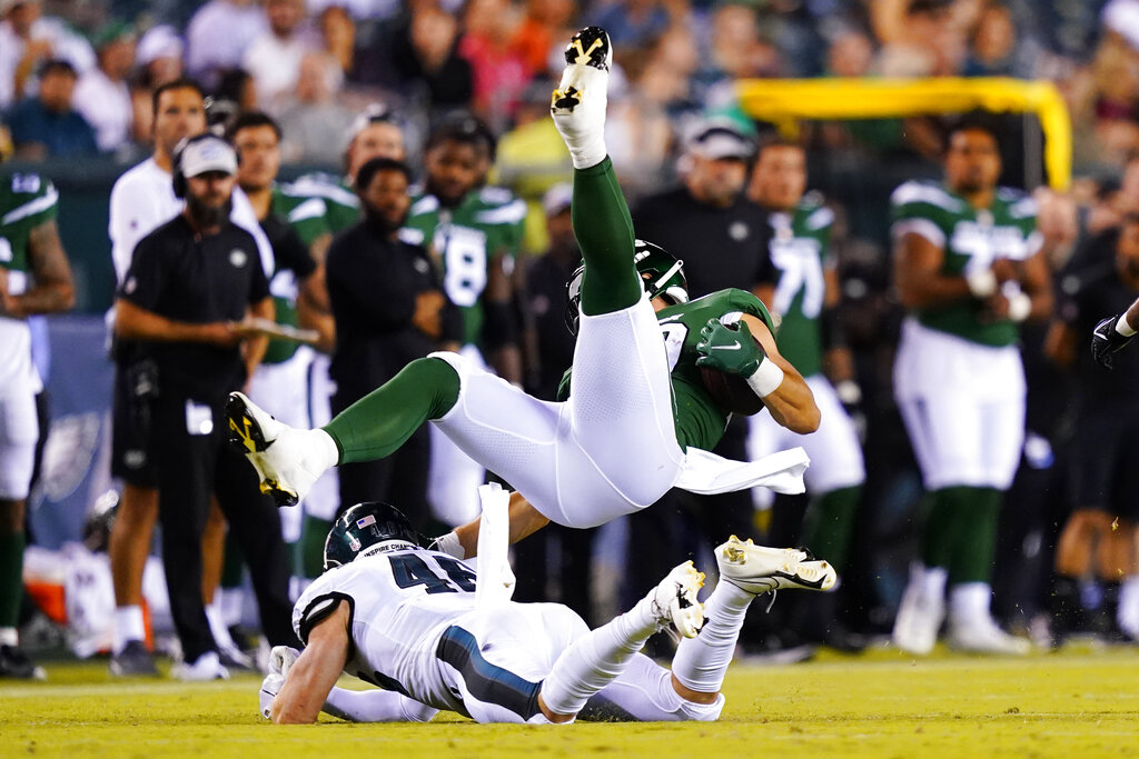 Chandler Wooten of the Carolina Panthers tackles Jeremy Ruckert of