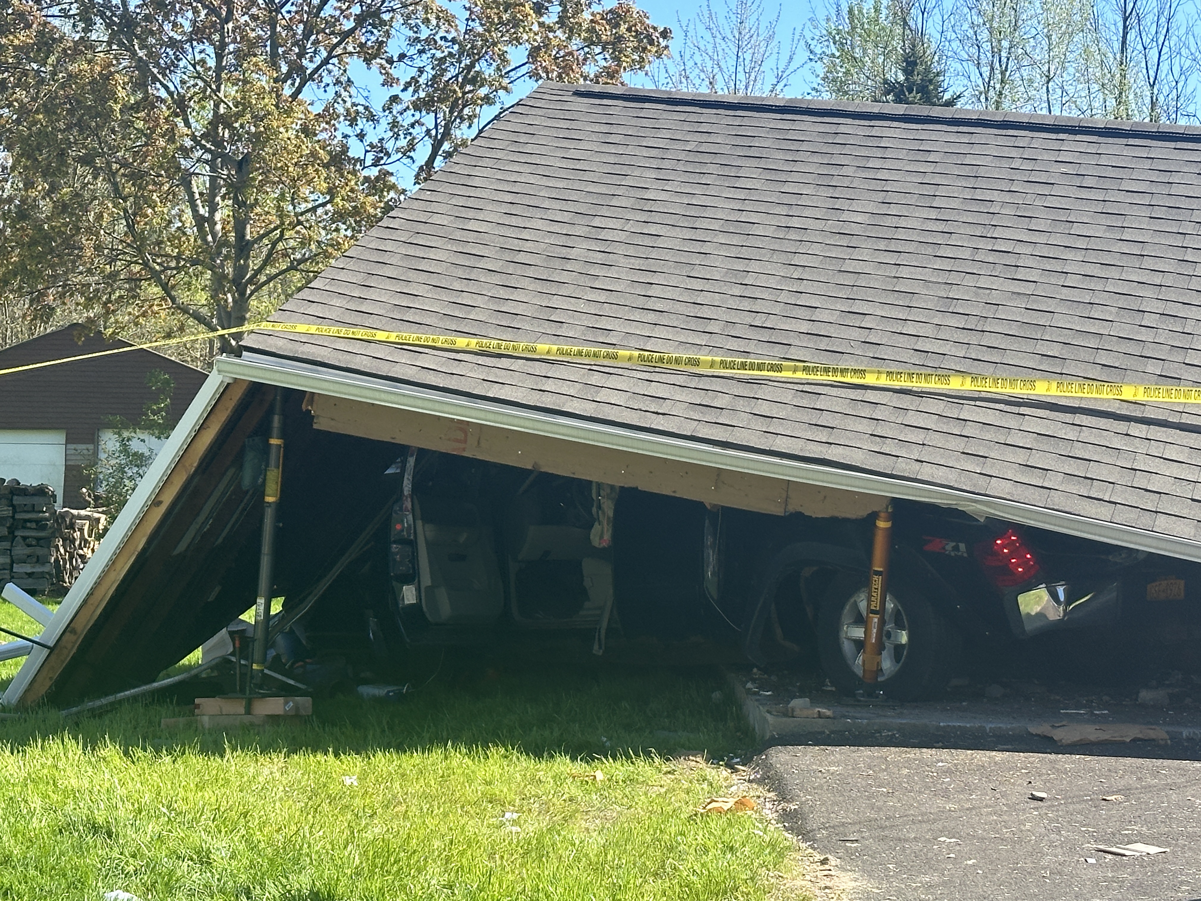 Garage roof collapses on truck after man crashes into Cicero home