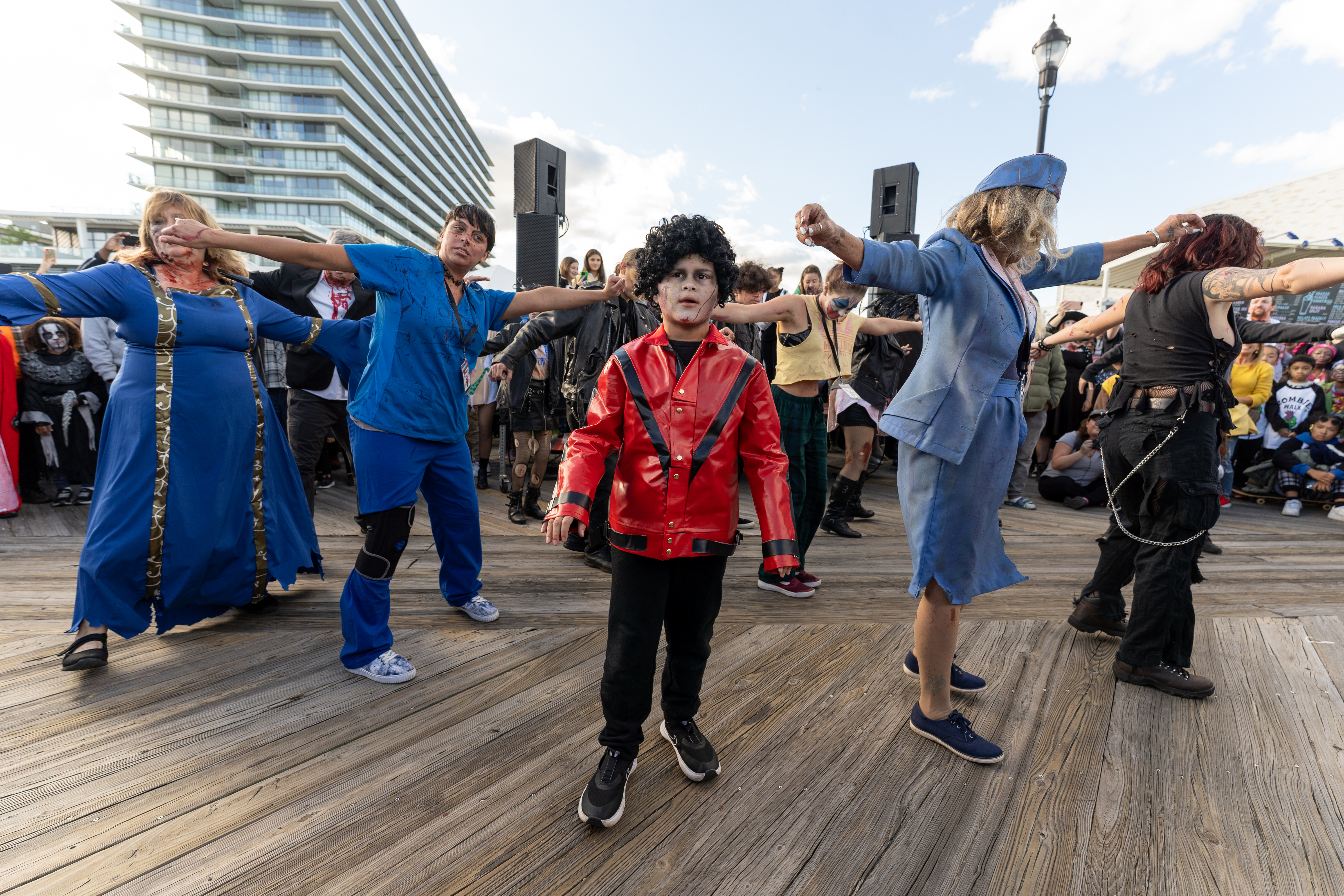 Joseph Vodarsik-Judikic, dressed as zombie Michael Jackson, participates in the zombie Thriller dance during the 14th Asbury Park Zombie Walk in Asbury Park on Saturday, October 8, 2022. The zombie walk held its first themed year with the theme being 80's and 90's punk and metal.