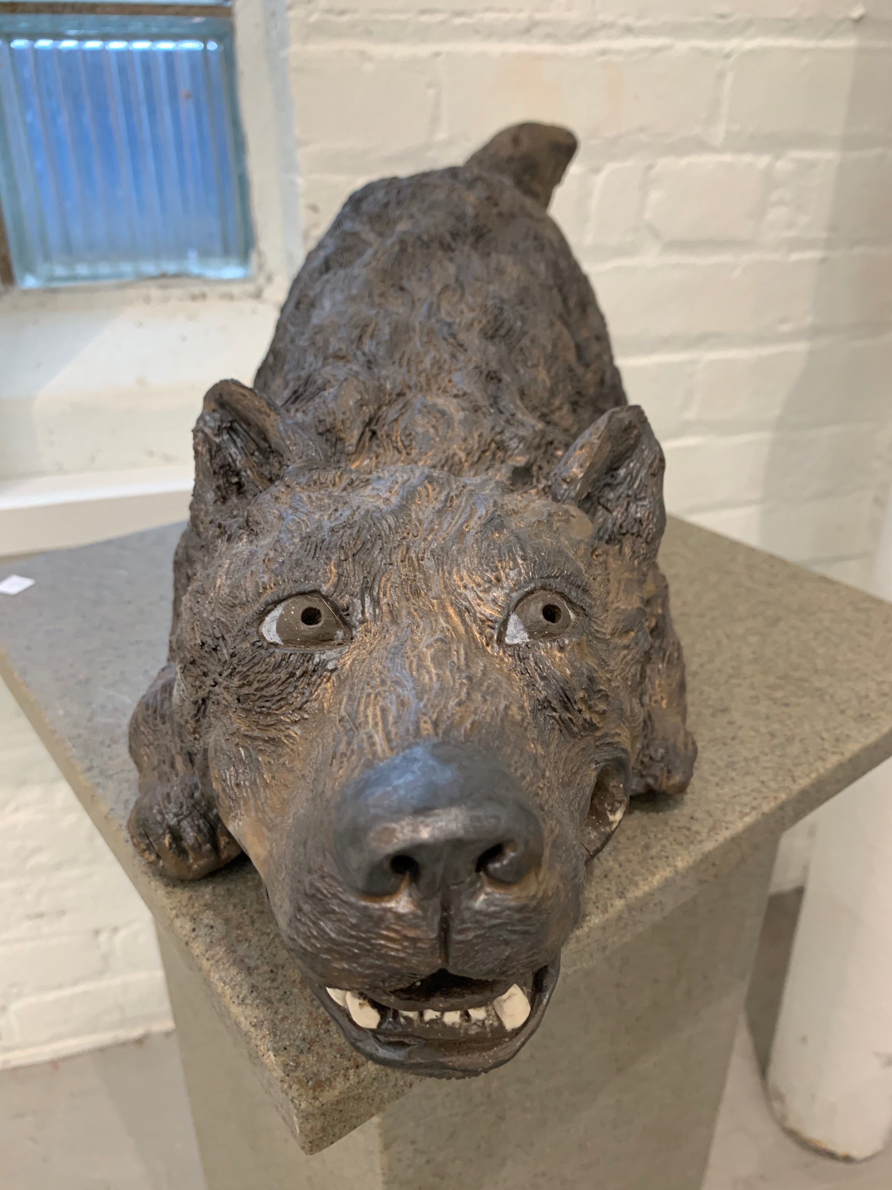 Kristen Newell's glazed ceramic sculpture, "Dog,'' growls playfully in a a holiday season exhibition at Abattoir gallery.