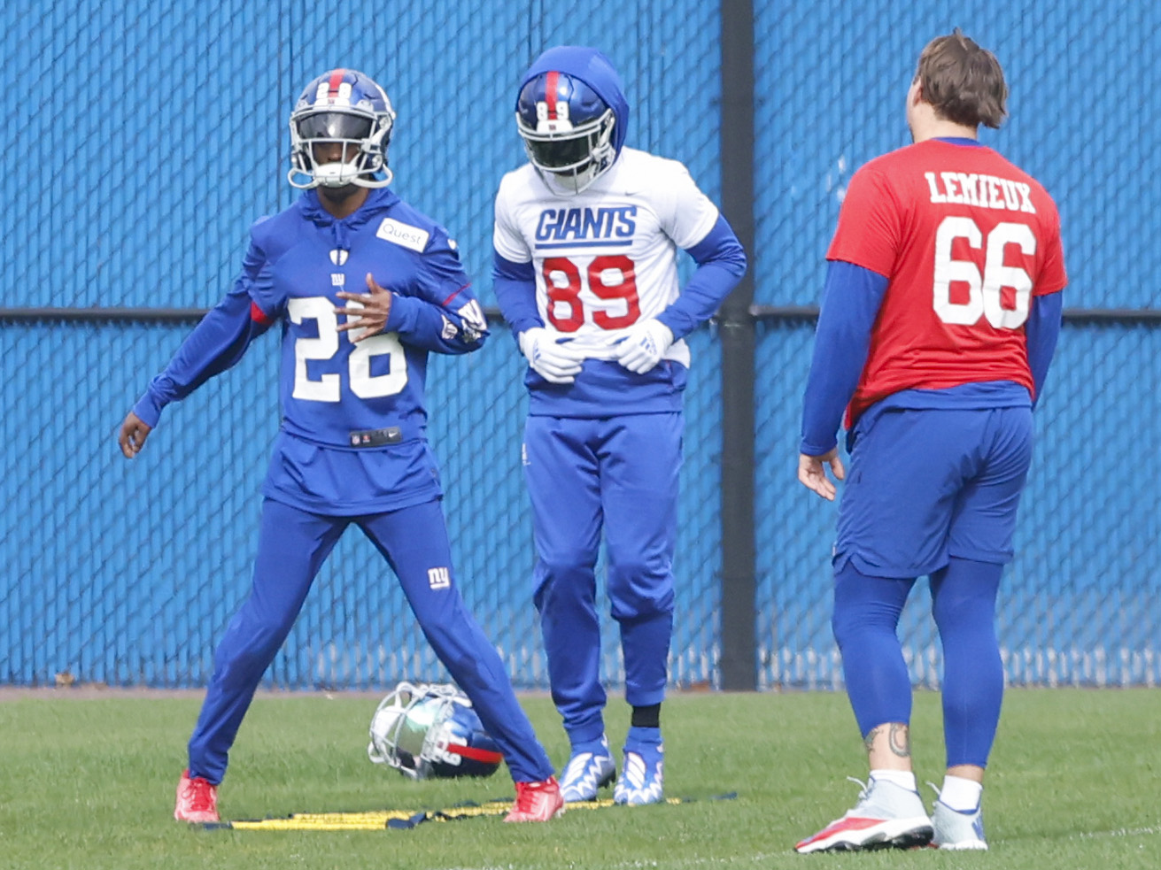 New York Giants cornerback Cor'Dale Flott (28), wide receiver Kadarius Toney (89) and guard Shane Lemieux (66) work on the side during practice on Wednesday, Oct. 26, 2022. 