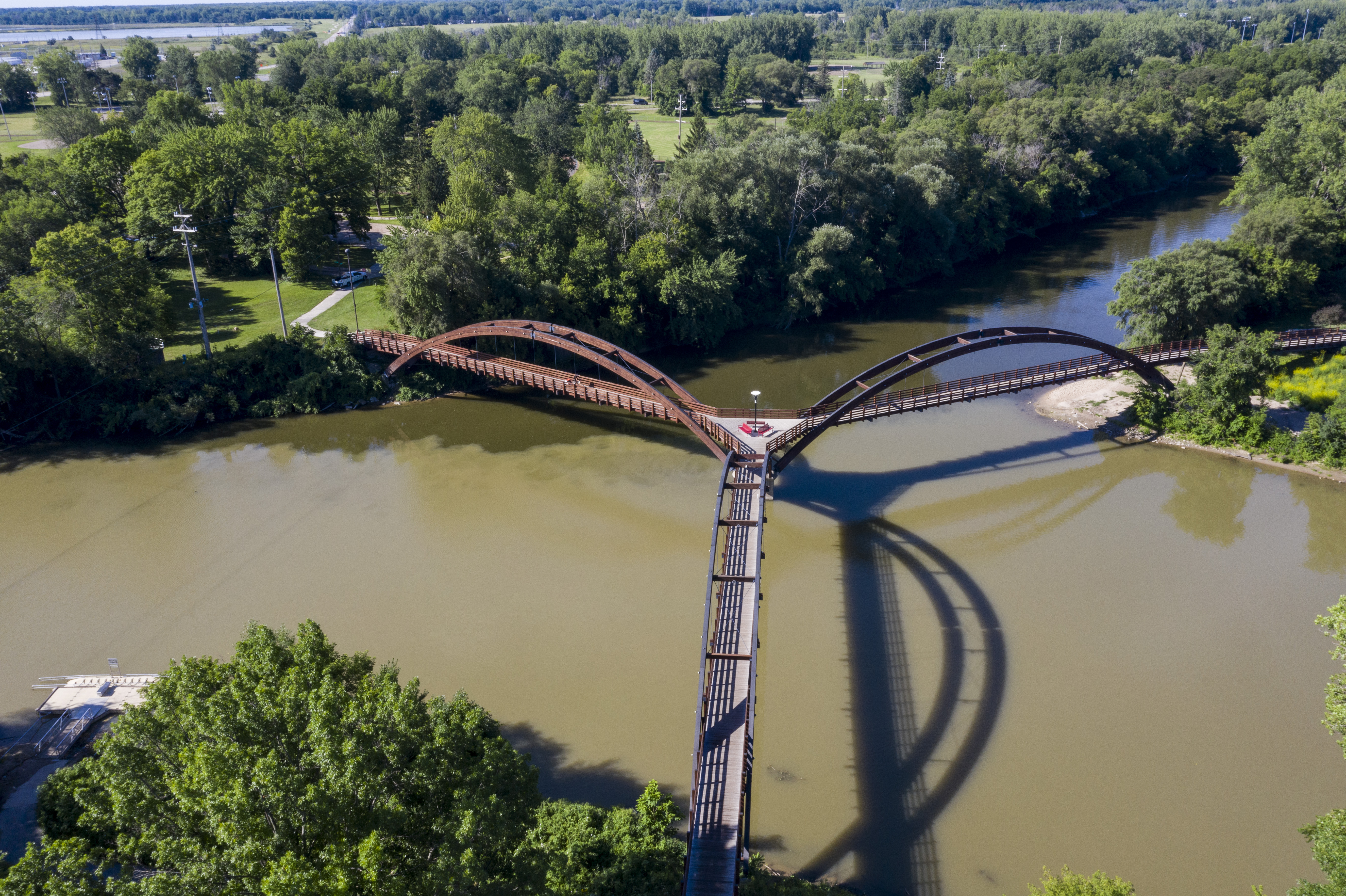 A view of the Tittabawasse River and the Tridge in Midland on Thursday, July 30, 2020. The devastating flood in May gushed over the majority of land in this area. (Kaytie Boomer | MLive.com)