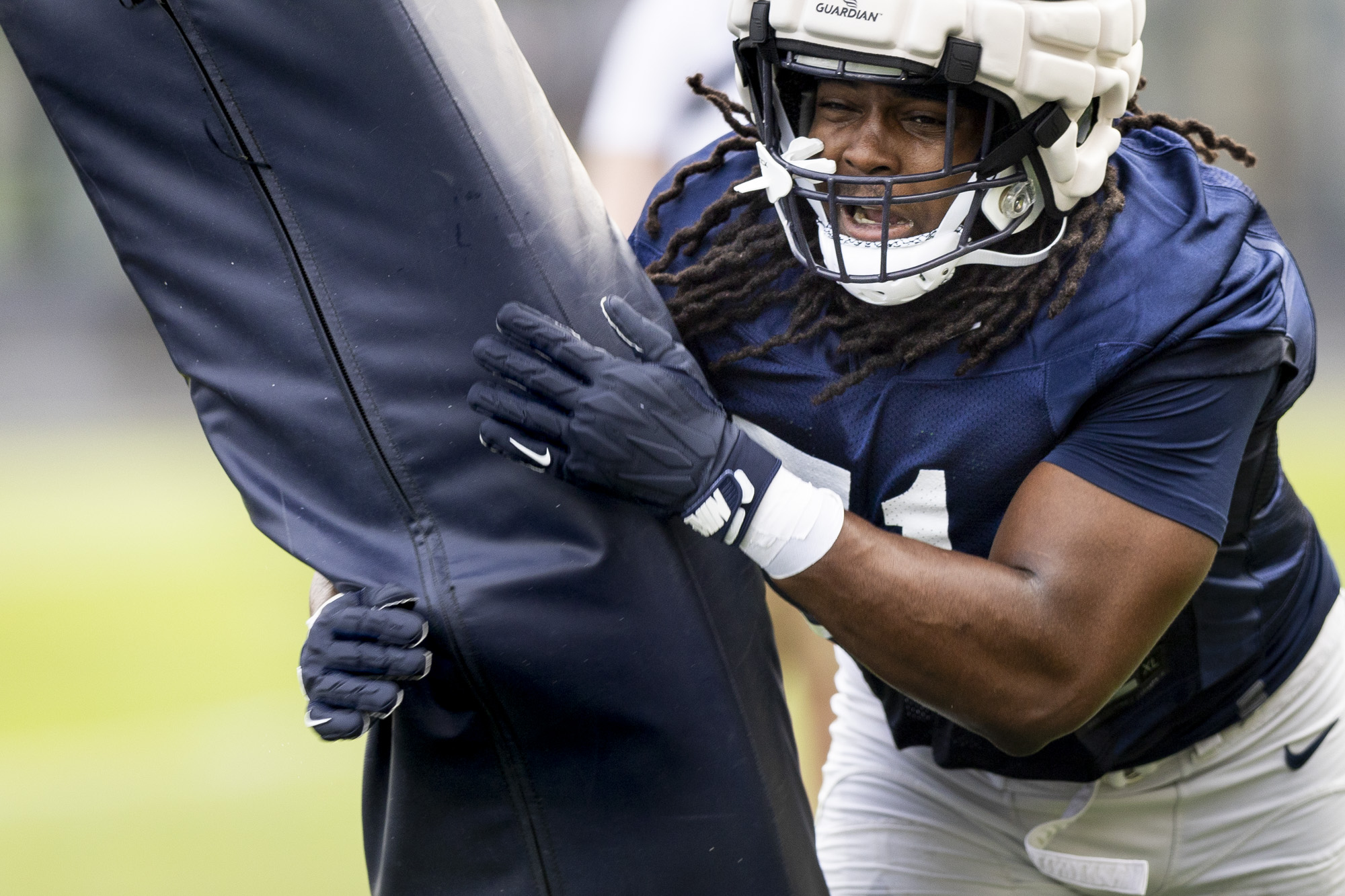 A new sight at Baltimore Ravens training camp: Guardian Caps - CBS