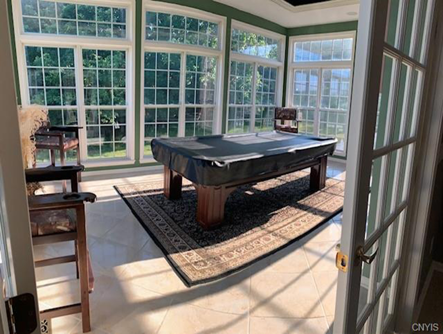 Brick Camillus home sits atop a hill overlooking six acres