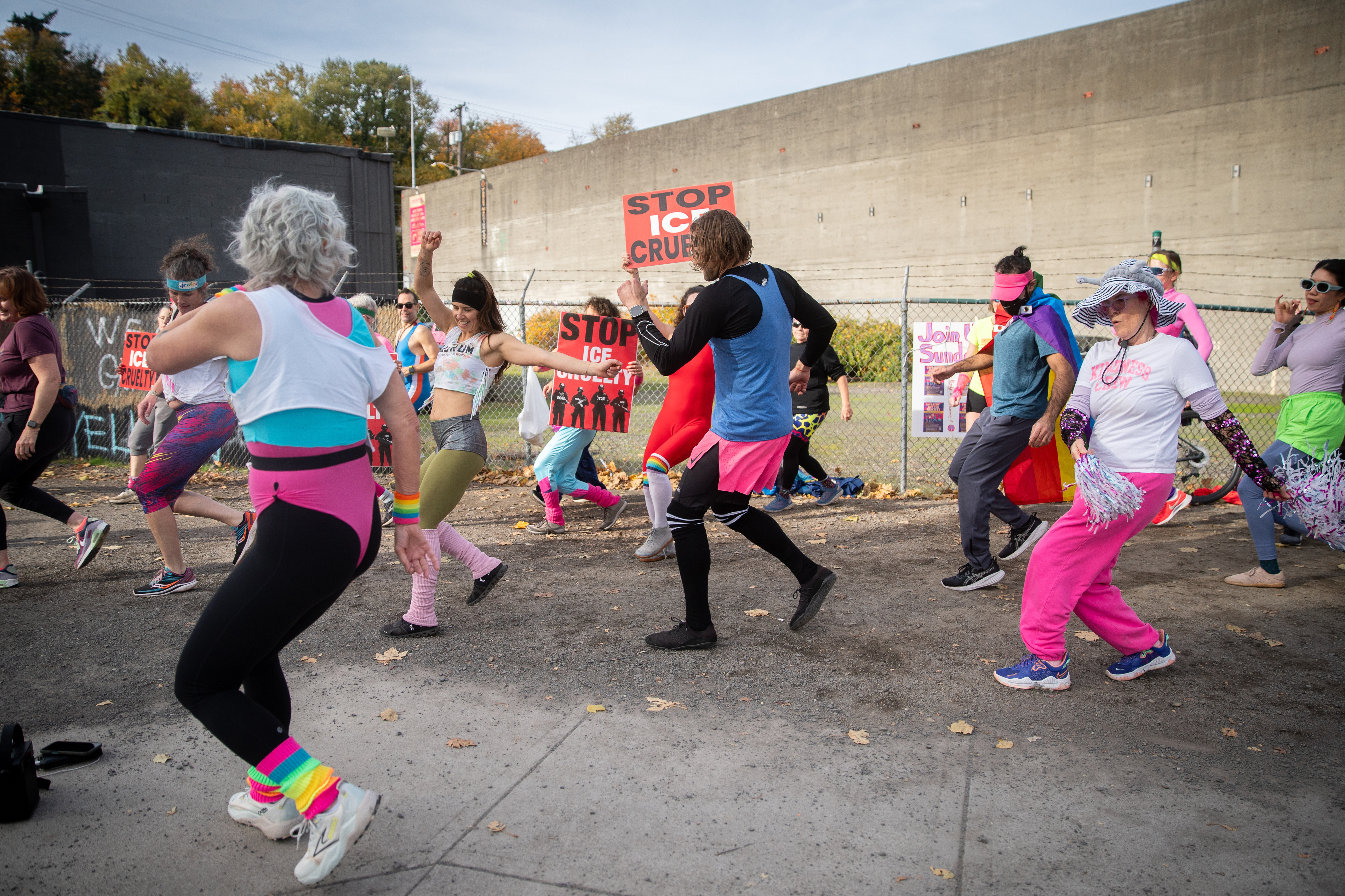 Participants in Fulcrum Fitness’s “Sweatin’ Out the Fascists” held an ’80s-aerobics peaceful protest outside the U.S. Immigration and Customs Enforcement (ICE) facility in South Portland on Sunday, Nov. 9, 2025, collecting donations for the Oregon Food Bank.