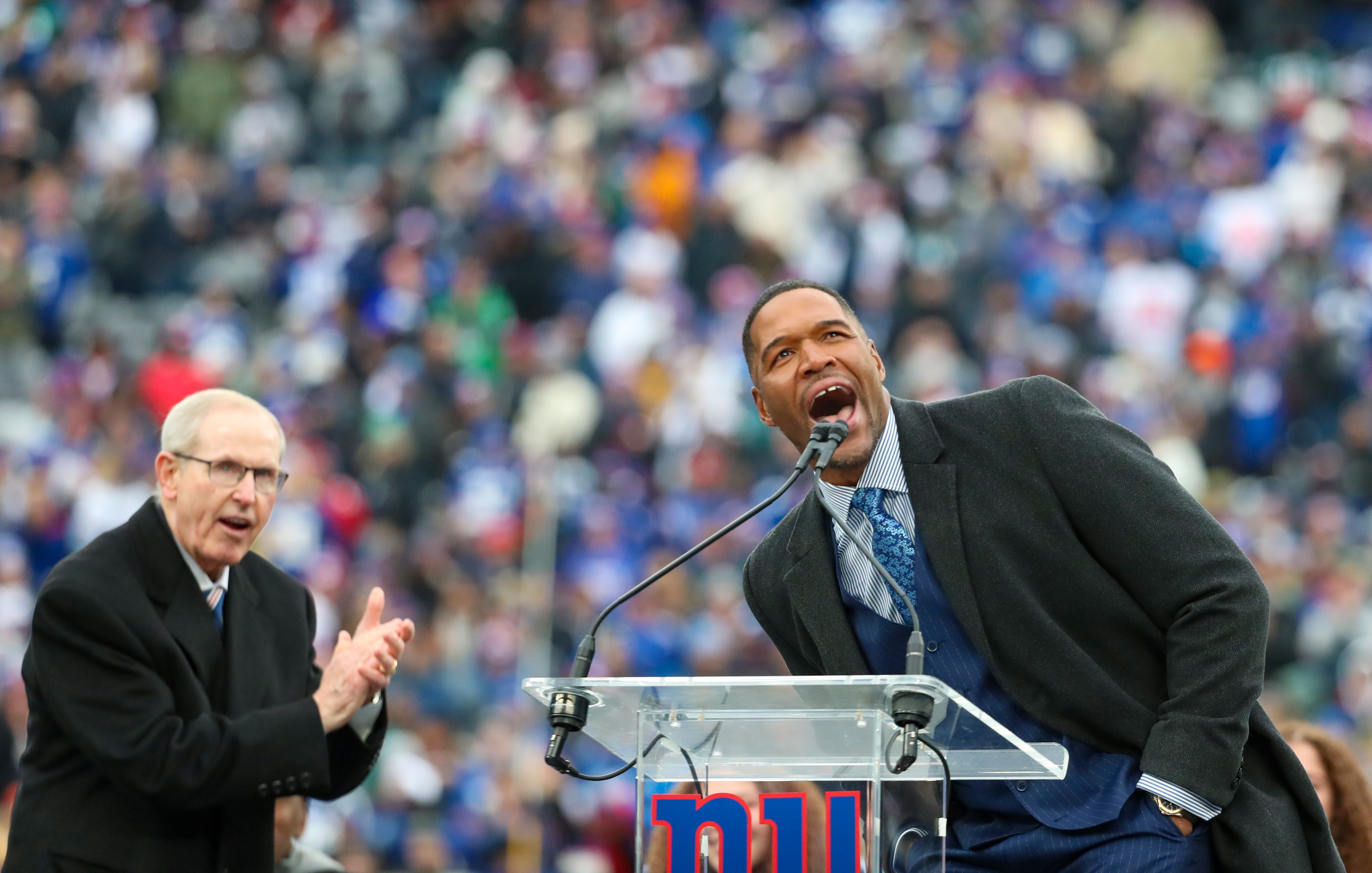 Former New York Giants head coach Tom Coughlin and Michael Strahan during a halftime ceremony to retire Strahan’s No. 92 jersey on Sunday, Nov. 28, 2021 at MetLife Stadium.