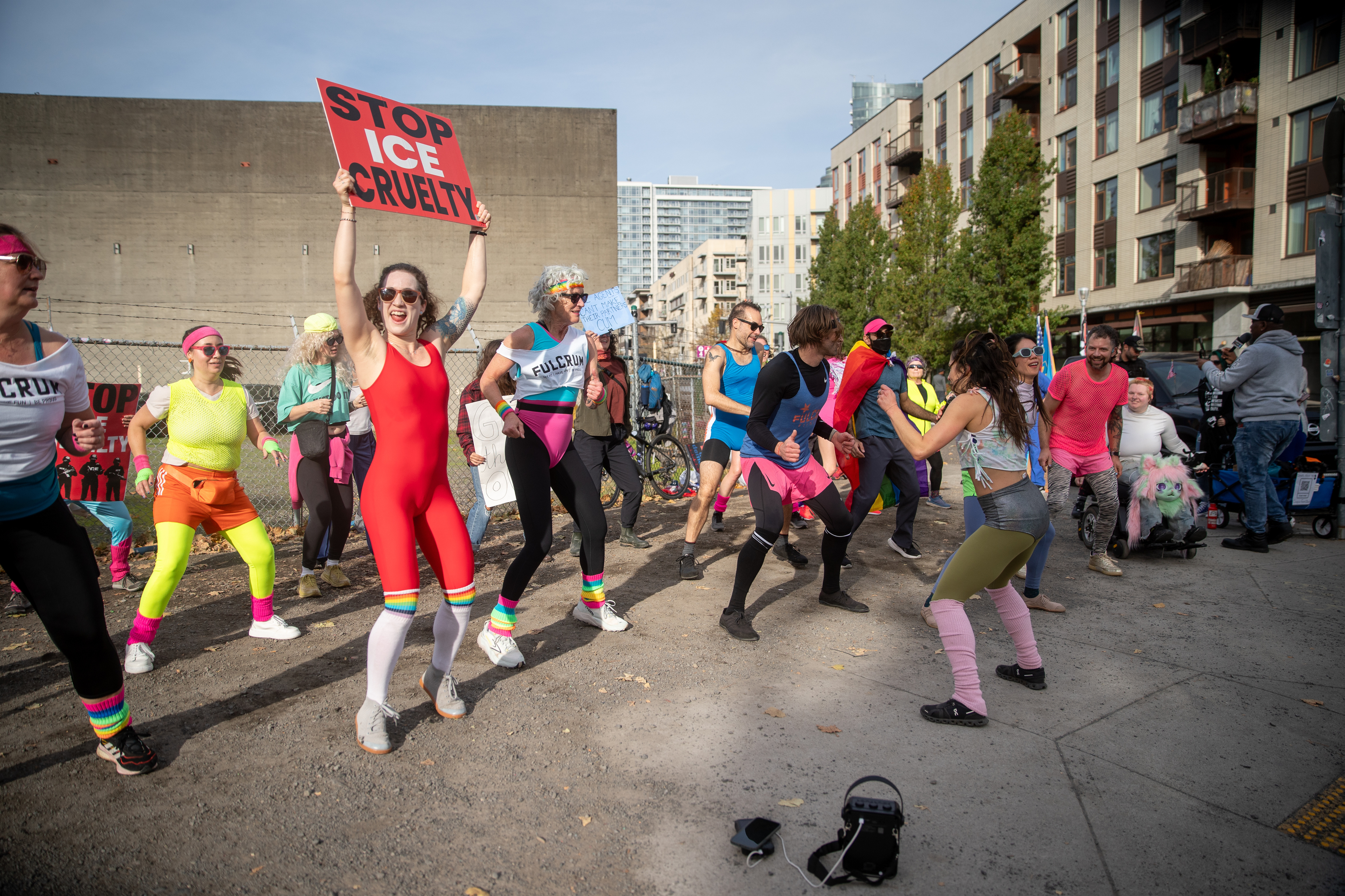 Participants in Fulcrum Fitness’s “Sweatin’ Out the Fascists” held an ’80s-aerobics peaceful protest outside the U.S. Immigration and Customs Enforcement (ICE) facility in South Portland on Sunday, Nov. 9, 2025, collecting donations for the Oregon Food Bank.