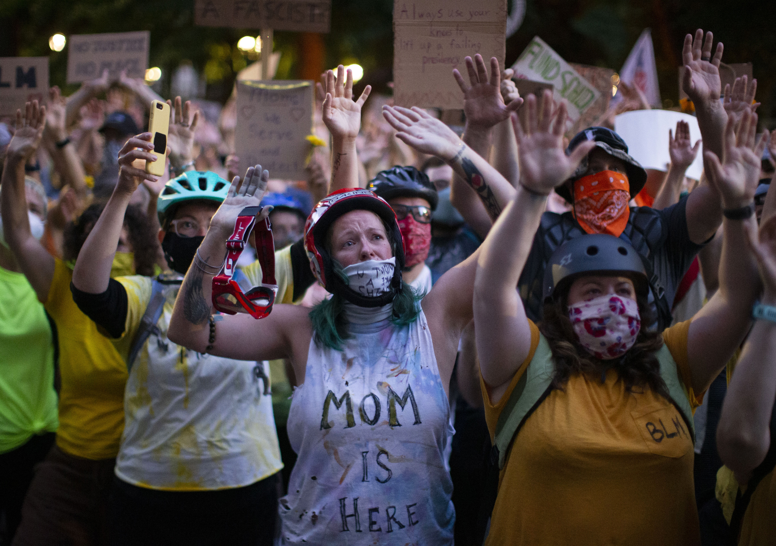 Protesters, including members of the "Wall of Moms" group, gather outside the Justice Center in Portland on July 20, 2020.