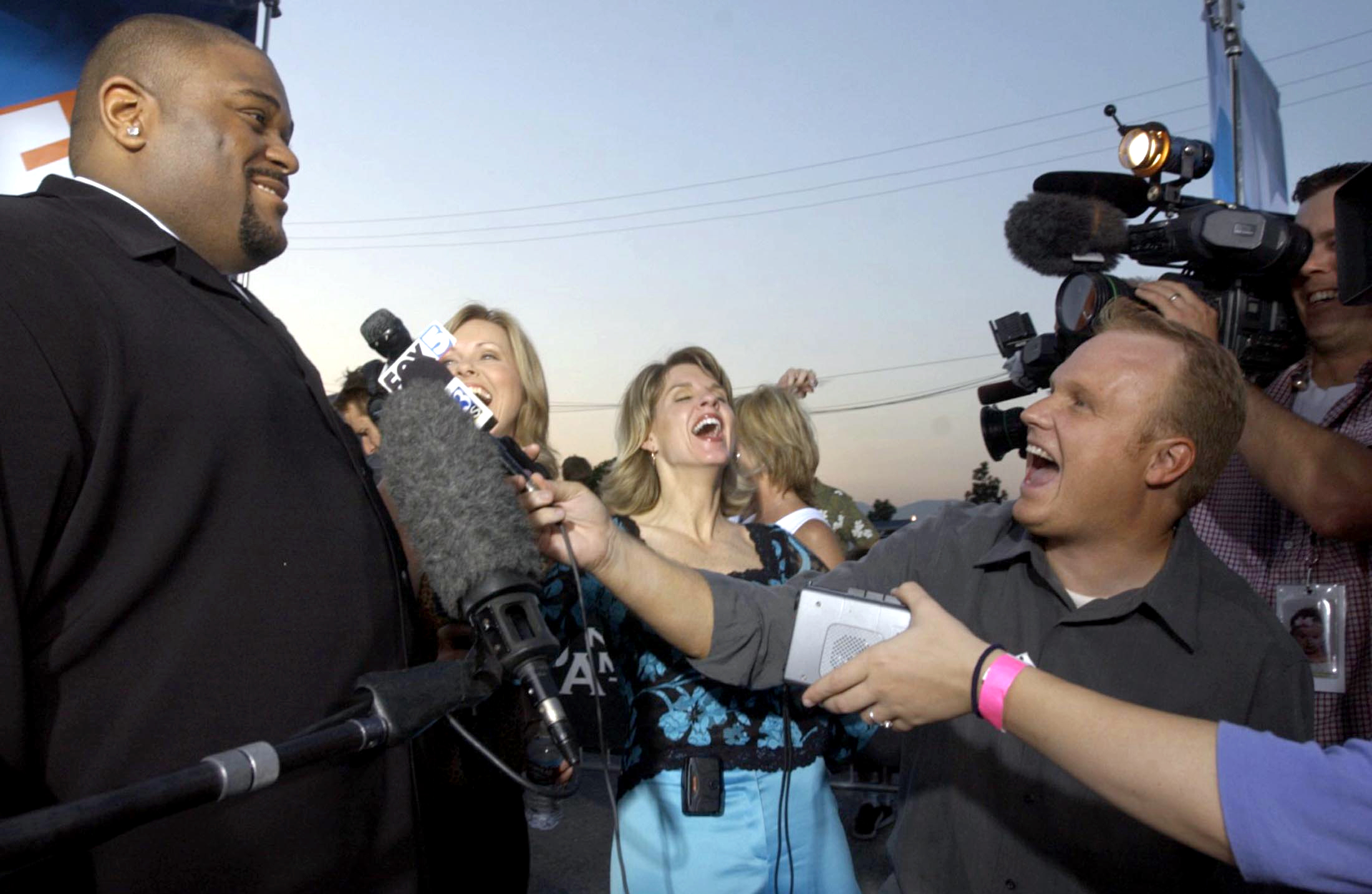 Reporters laugh after American Idol finalist and Birmingham native Ruben Studdard, left, says, "I doubt it man, I'm still big. Big is beautiful!" in answer to a reporter's question if he had lost weight, while interviewing outside the Universal Studios Ampitheater in Los Angeles, California. Studdard met the press after competing against Clay Aiken for the title of "American Idol." (AL.com file photo/Jacquelyn Martin)