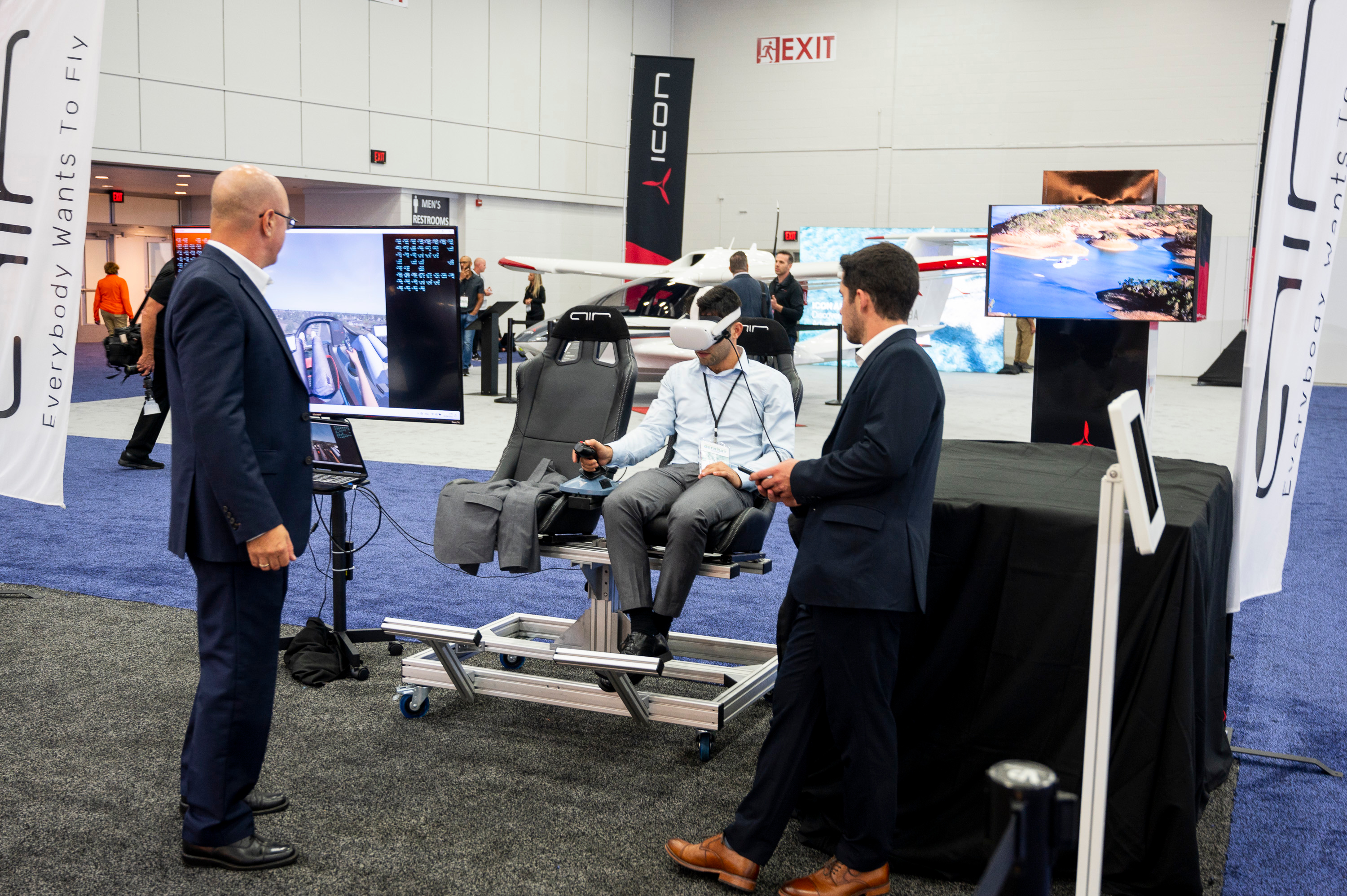 Guests experience a VR “flight” in the AIR booth during the 2022 North American International Auto Show at Huntington Place in Detroit on Wednesday, Sept. 14 2022.
