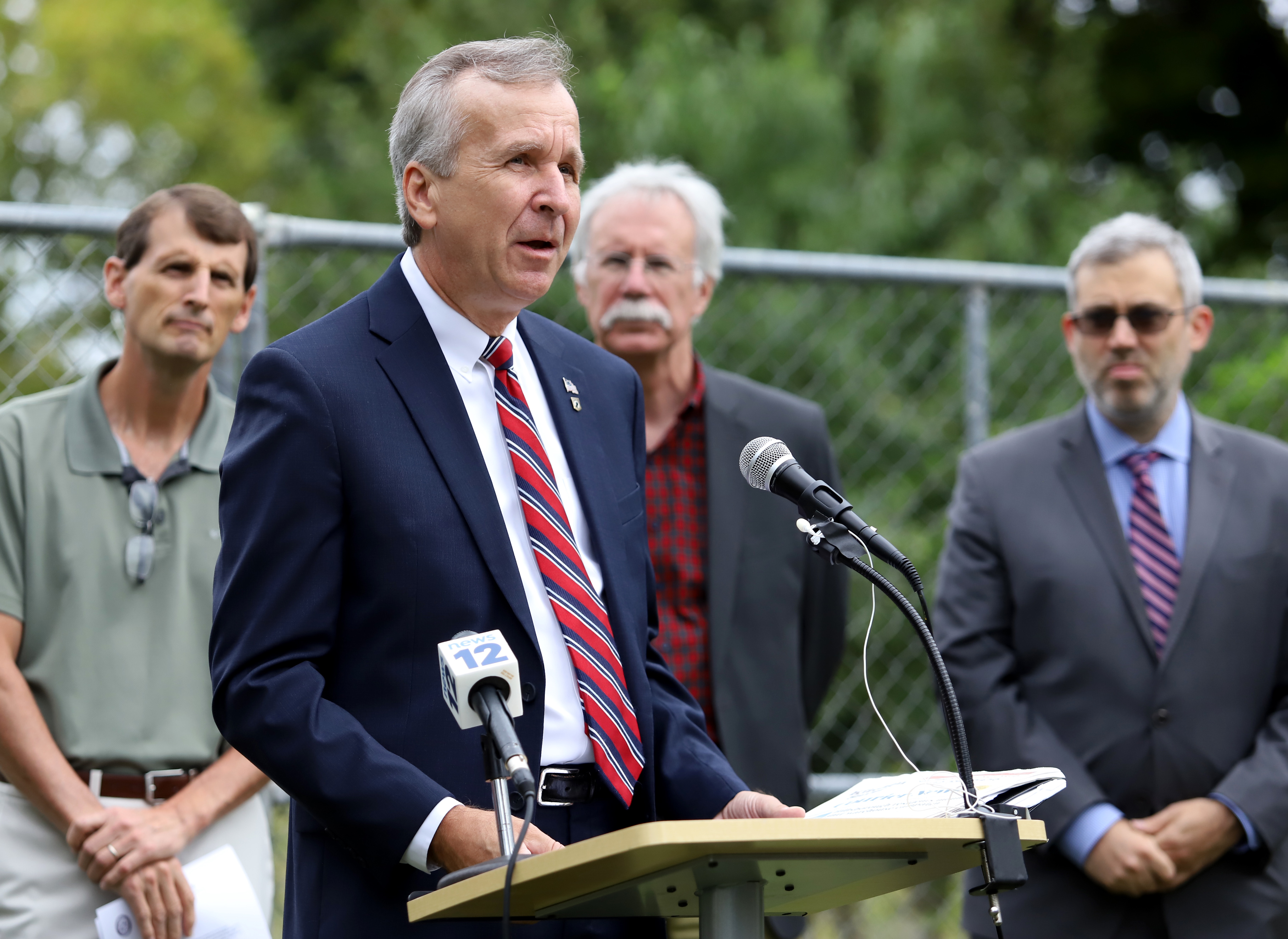Environmental leaders and elected officials hold a press conference on flooding issues and
