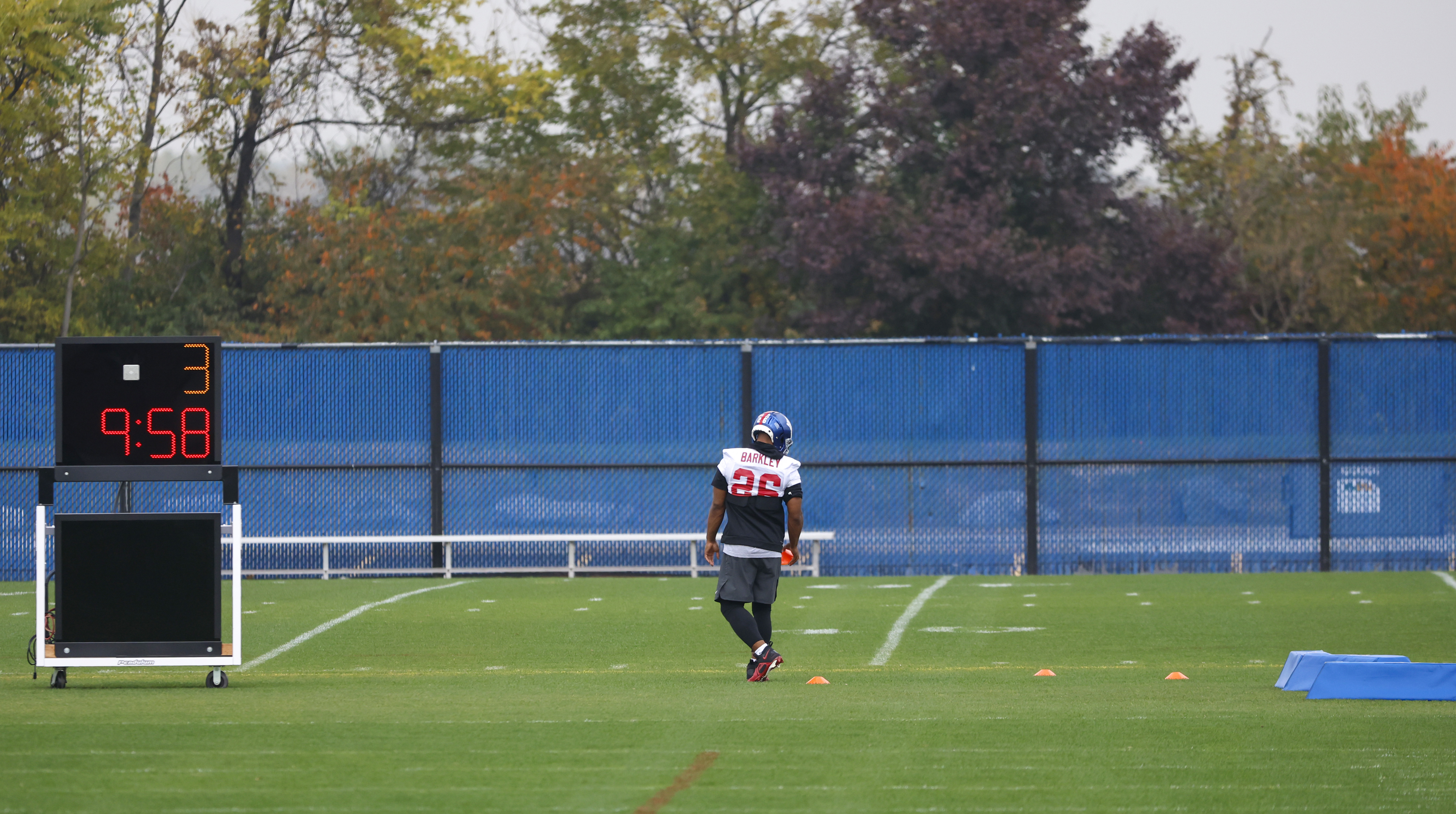 New York Giants running back Saquon Barkley (26) sets up cones during practice on Wednesday, Oct. 26, 2022. 