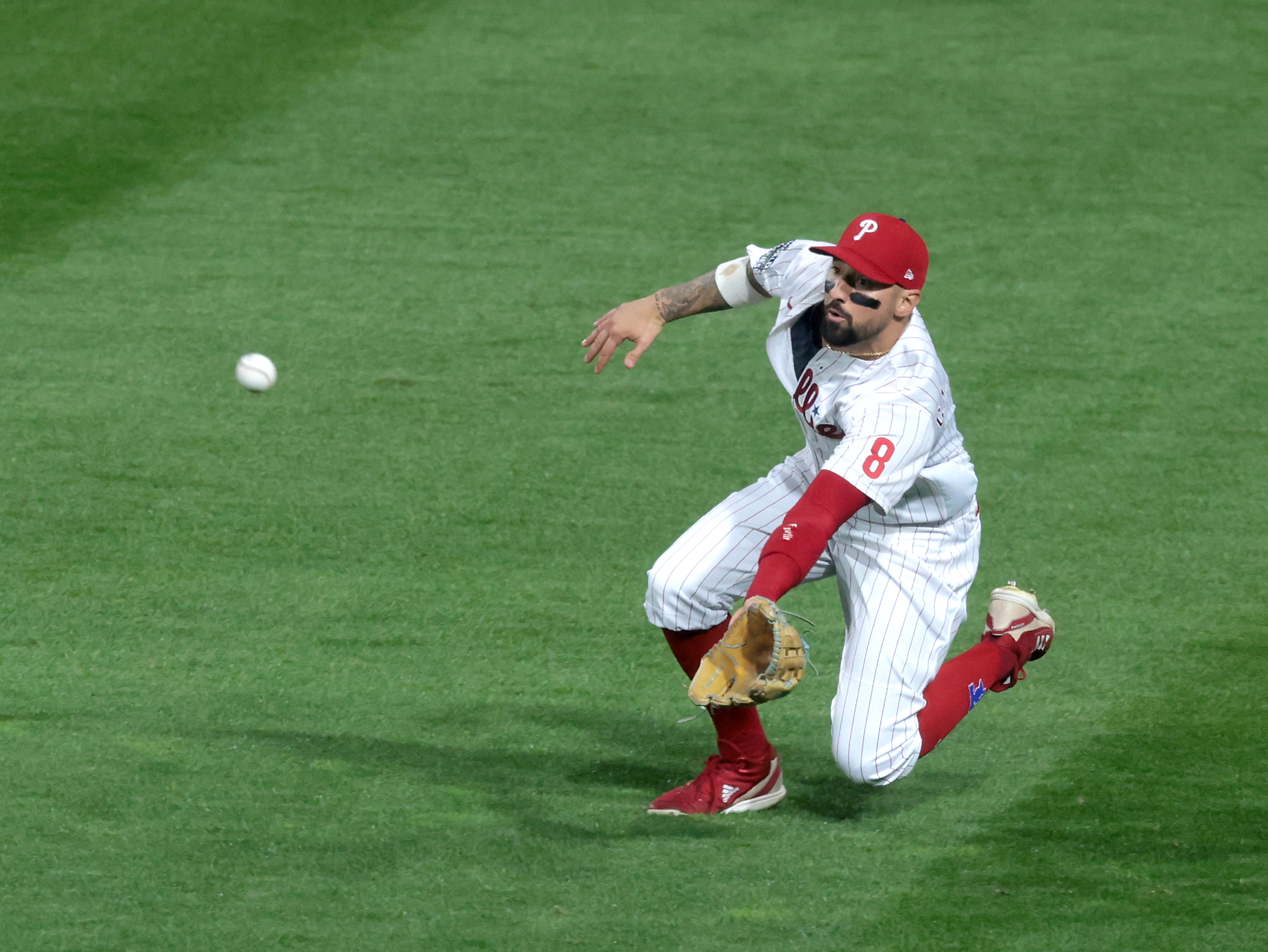 Nick Castellanos (8) of the Philadelphia Phillies makes a diving catch vs. the Houston Astros in the first inning during Game 3 of the World Series at Citizens Bank Park, Tuesday, Nov. 1 2022.