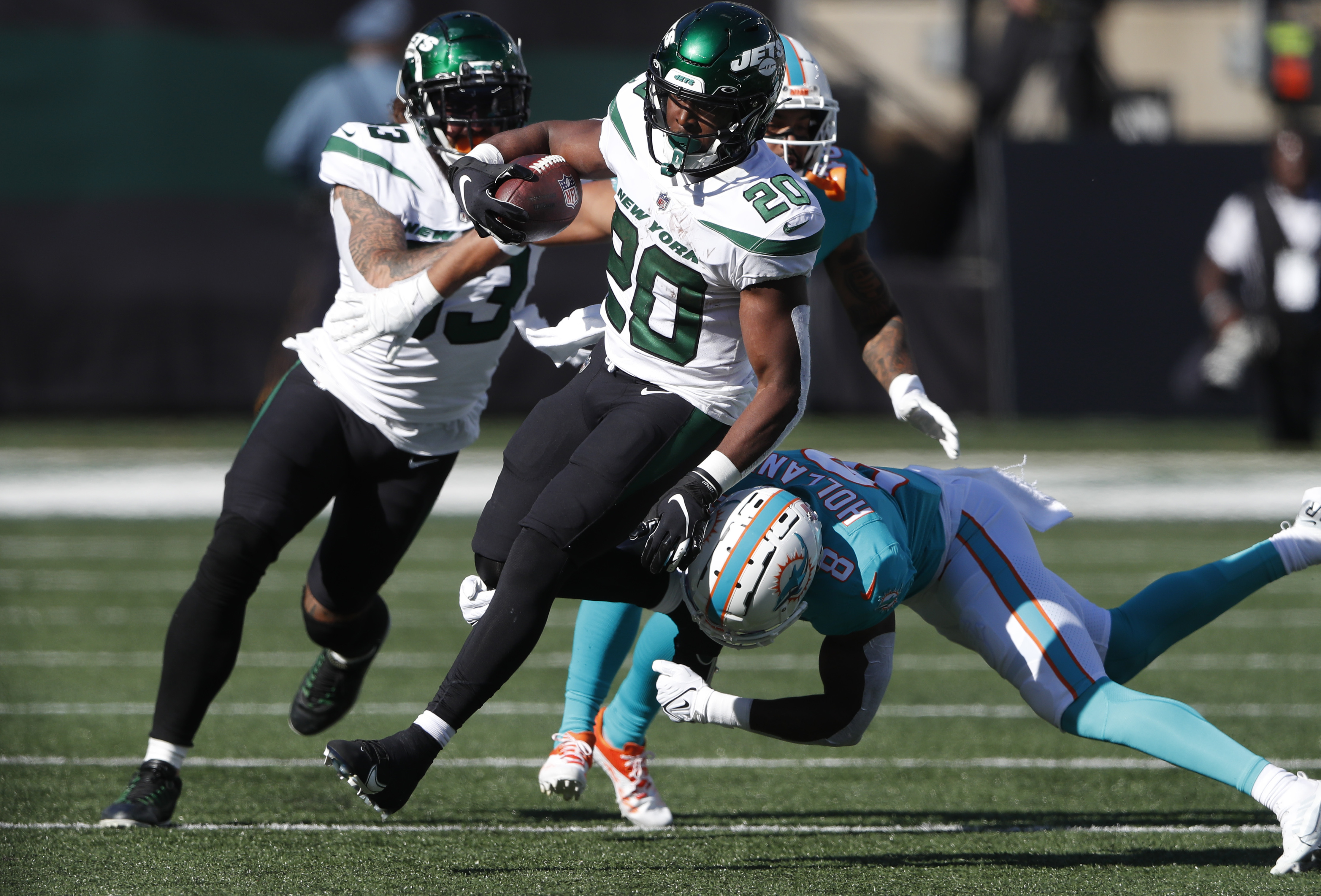 New York Jets running back Breece Hall (20) rushes against Miami Dolphins  during the first half of an NFL football game on Sunday, Oct. 9, 2022, in  East Rutherford, N.J. (AP Photo/Noah