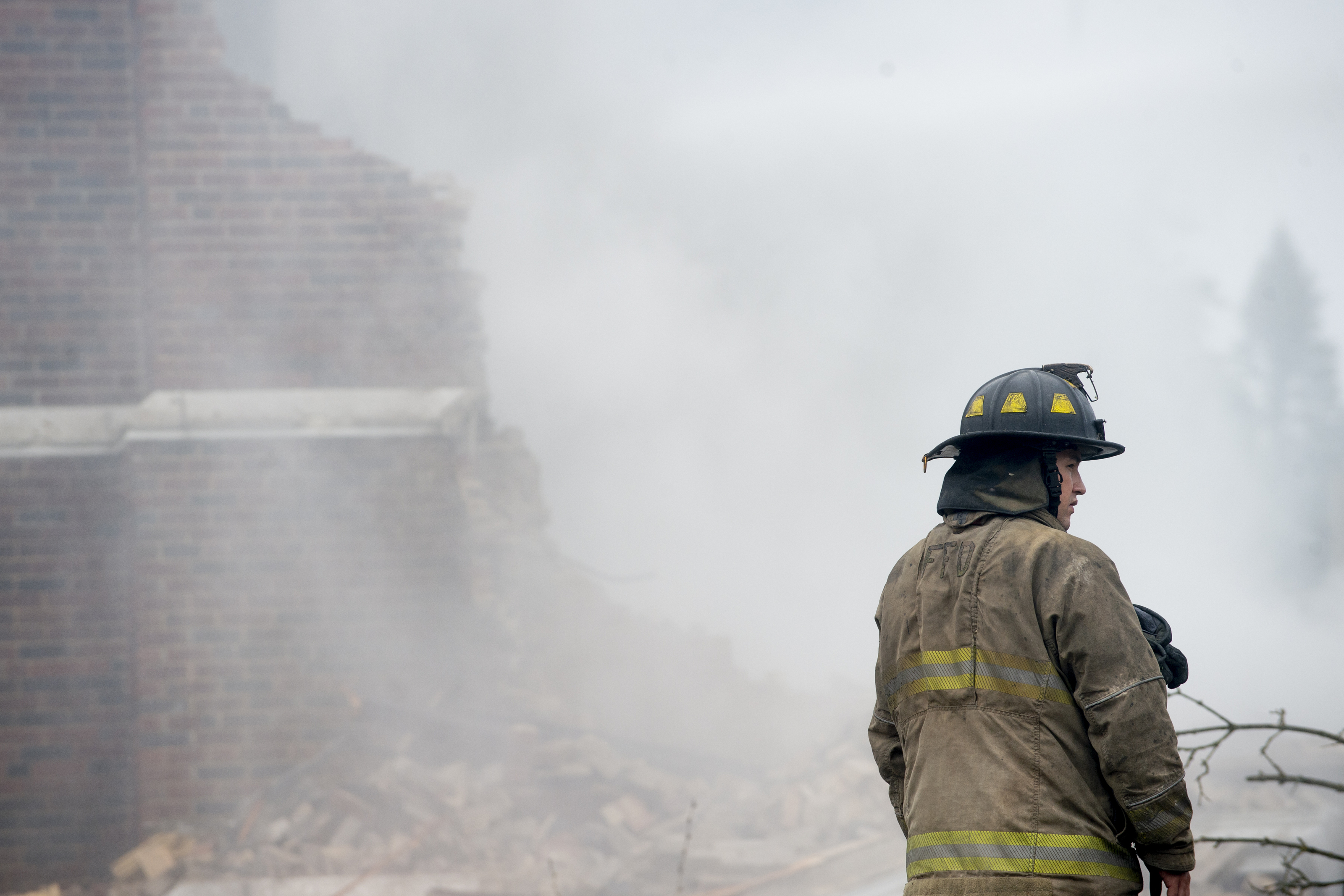 Firefighters work to contain a fire that started at about 12:30 a.m. on Thursday Oct. 7, 2021 at the former Washington Elementary School, located at 1400 N. Vernon Ave. in Flint. The building was built in 1922 before closing in 2013. (Jake May | MLive.com)