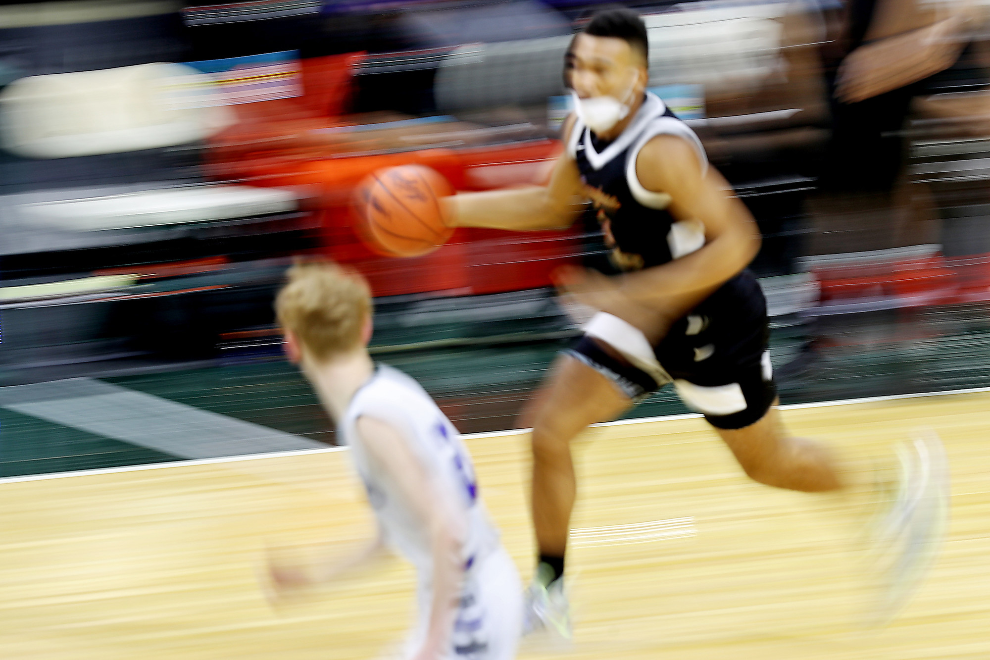 Photos of Detroit Douglass basketball player Pierre Brooks II