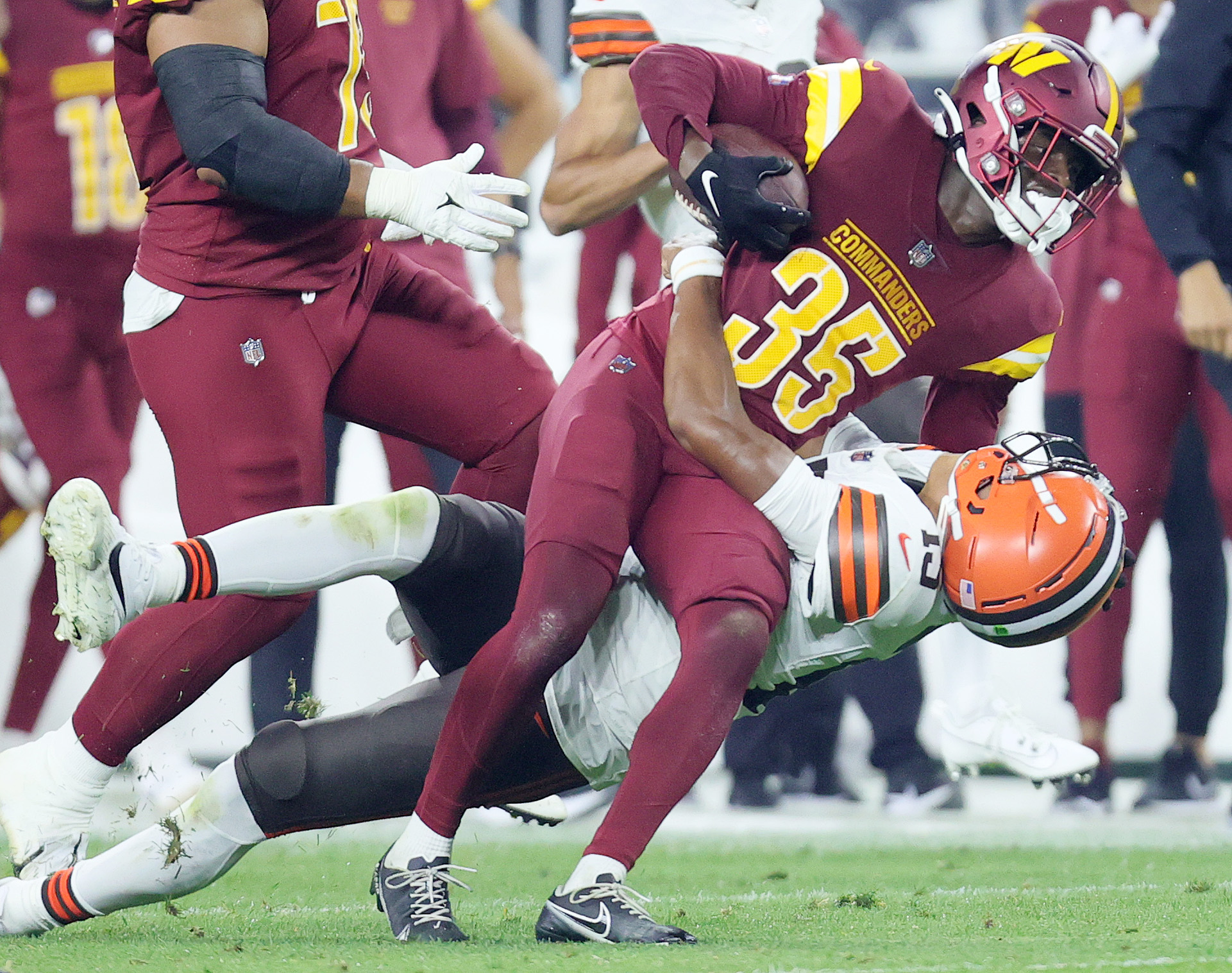 Washington Commanders defensive end KJ Henry (55) stands on the sideline  during an NFL pre-season football game against the Cleveland Browns,  Friday, Aug. 11, 2023, in Cleveland. (AP Photo/Kirk Irwin Stock Photo 