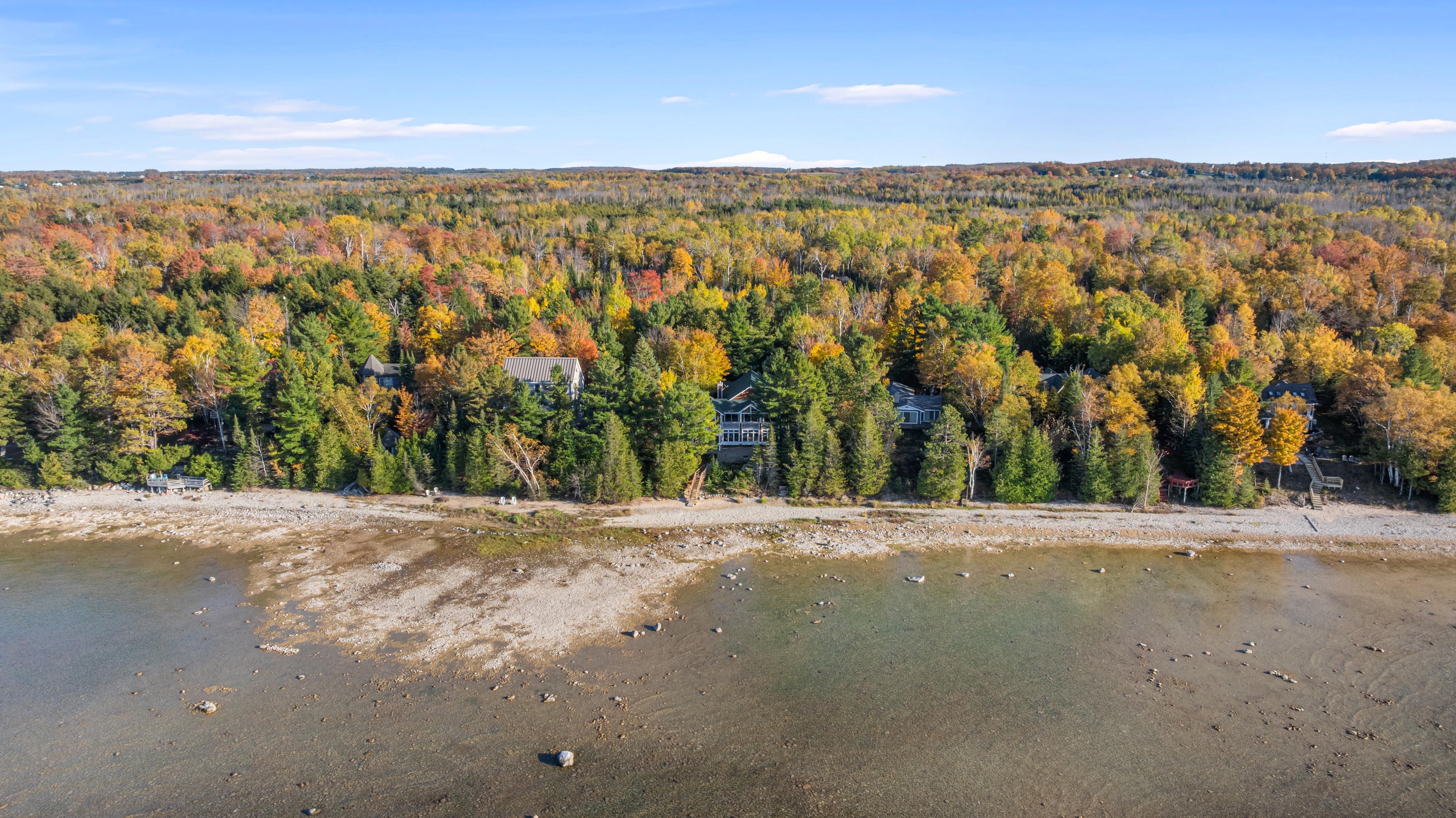 Aerial photographs of 4093 Lake Shore Drive in Charlevoix, this gem is listed at $2,099,900 through Berkshire Hathaway HomeServices Michigan Real Estate – Traverse City and The Crane Group with associate broker Johnny Crane and his brother, co-listing agent Matt Crane.
