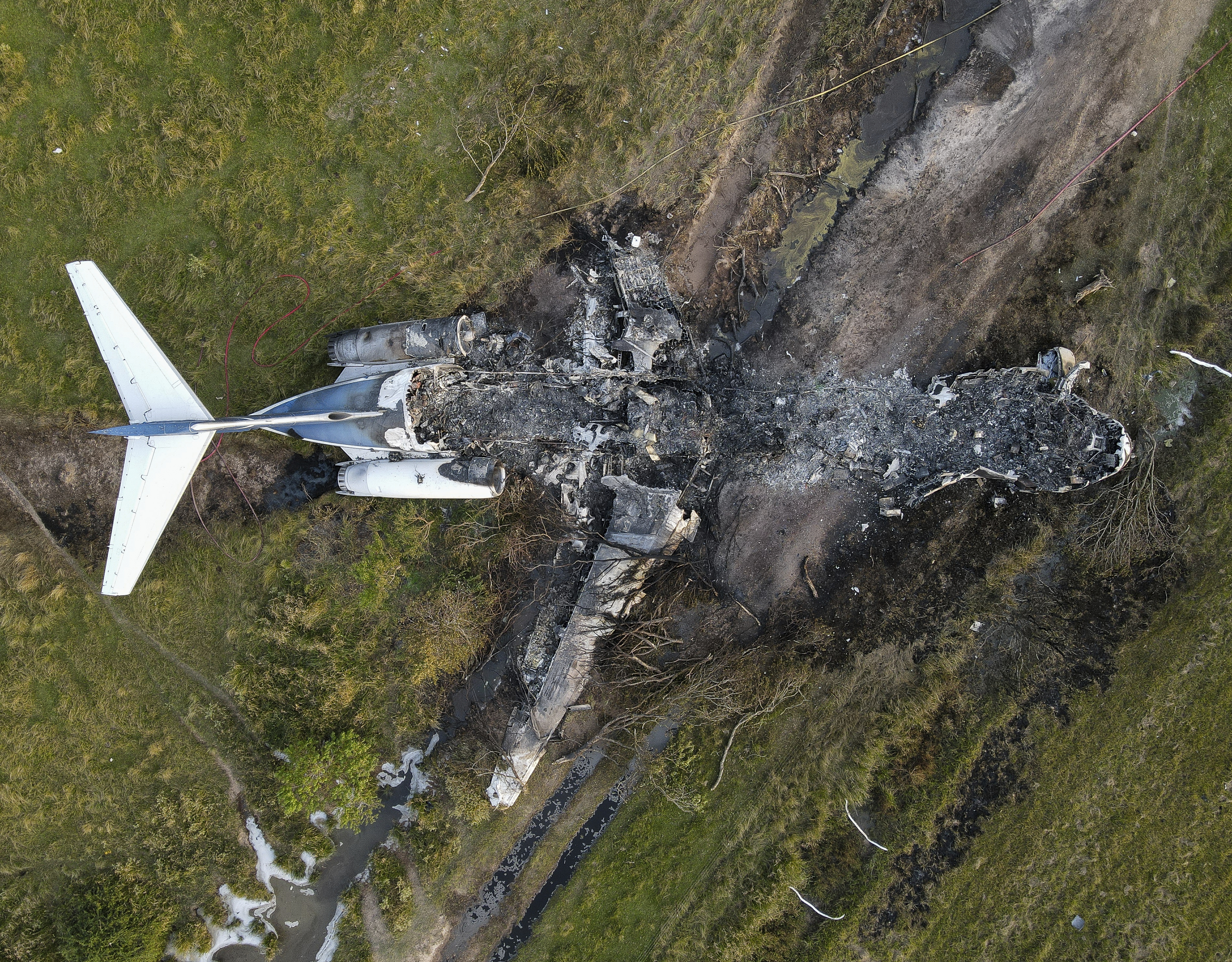 Photos show wreckage after plane with fans going to Red Sox Astros