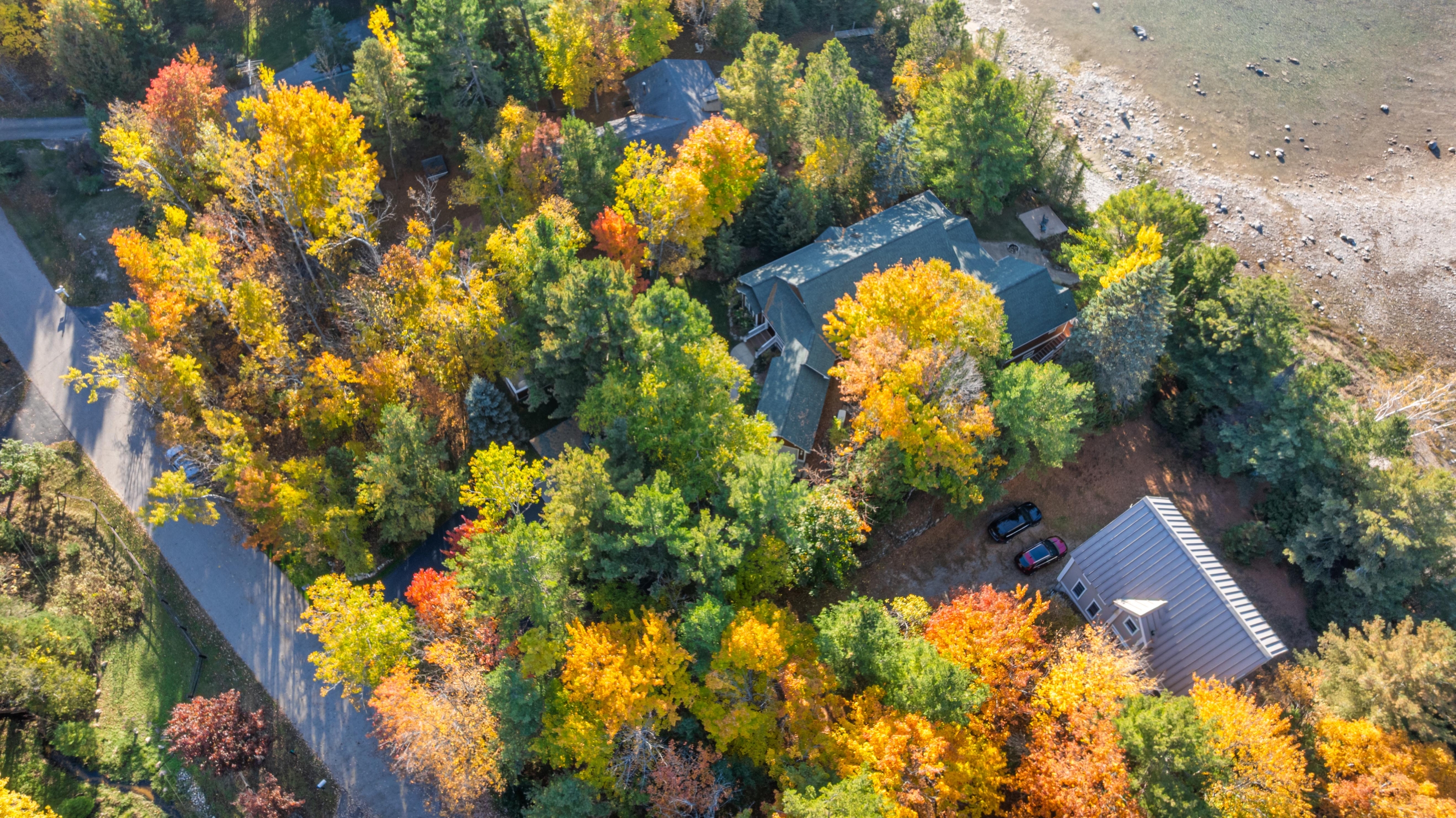 Aerial photographs of 4093 Lake Shore Drive in Charlevoix, this gem is listed at $2,099,900 through Berkshire Hathaway HomeServices Michigan Real Estate – Traverse City and The Crane Group with associate broker Johnny Crane and his brother, co-listing agent Matt Crane.
