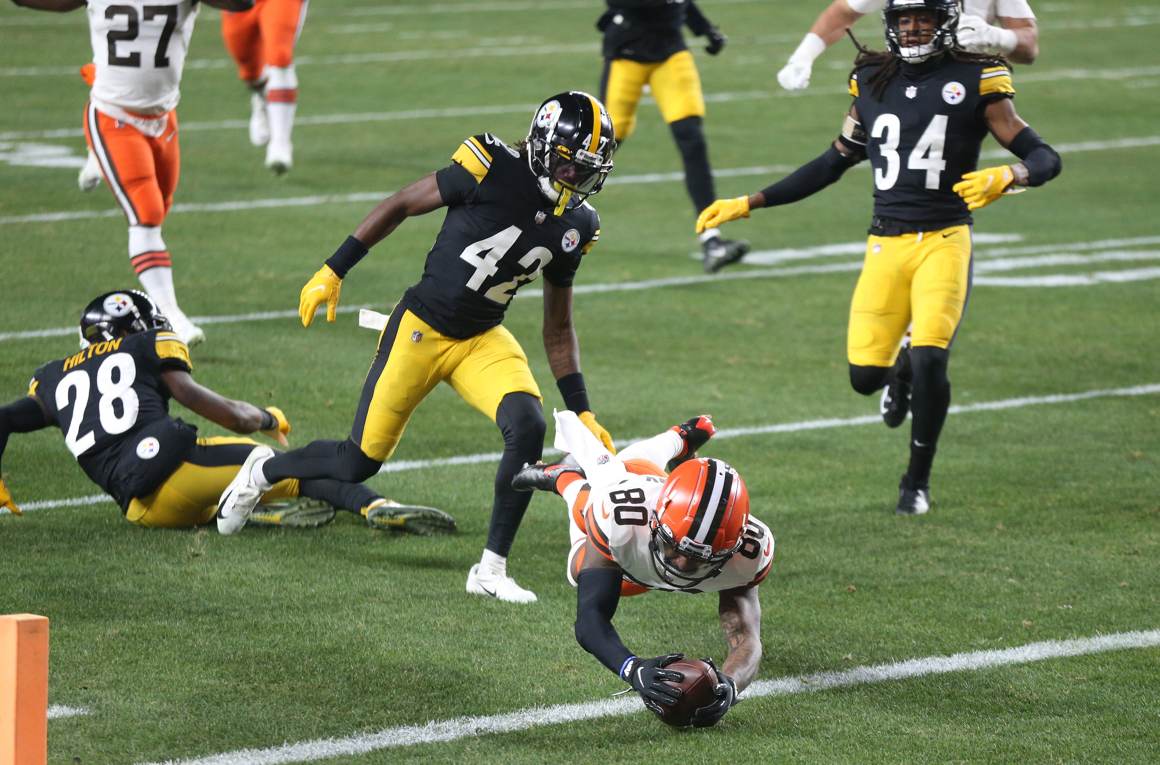 Pittsburgh Steelers free safety Minkah Fitzpatrick (39) celebrates with  wide receiver JuJu Smith-Schuster (19) on the sideline after scoring a  touchdown on an intercepted pass from Cleveland Browns quarterback Baker  Mayfield during