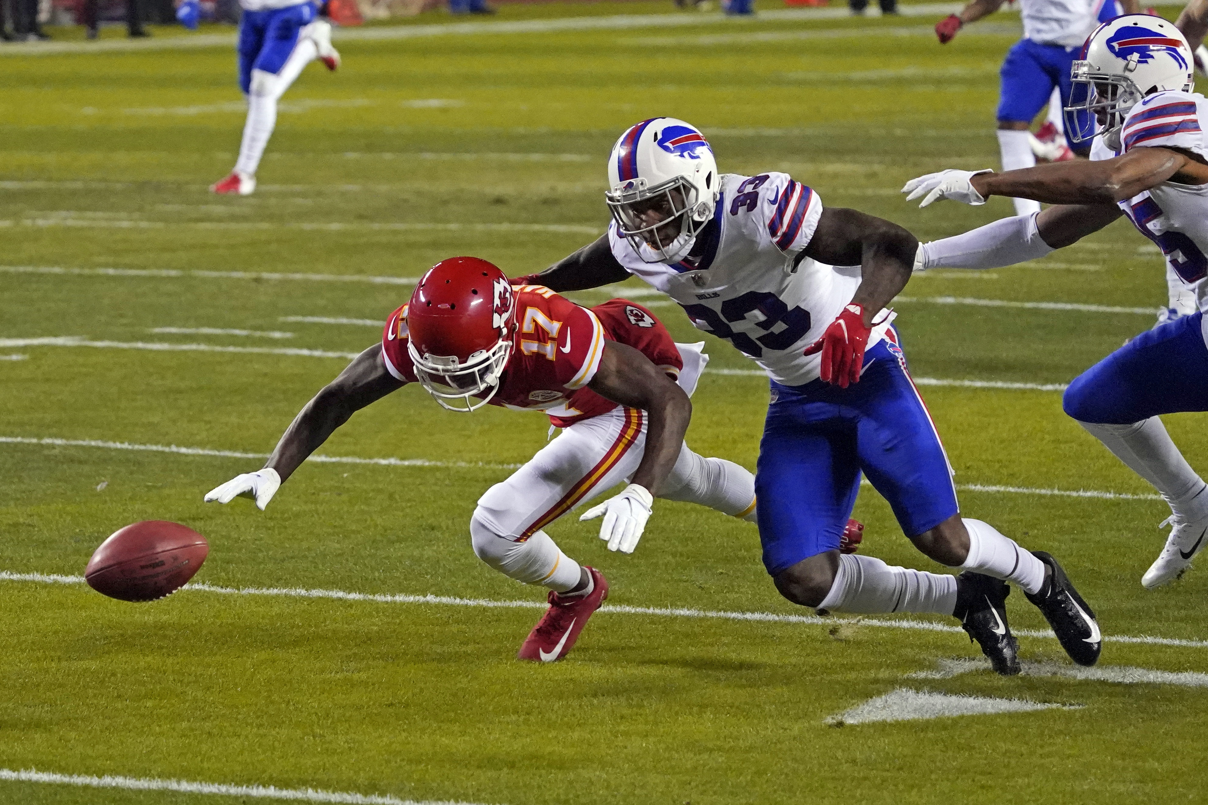 This pass to Buffalo Bills wide receiver Stefon Diggs (14) is broken up by  Kansas City Chiefs safety Juan Thornhill (22) and Kansas City Chiefs safety  L'Jarius Sneed (38) during the second