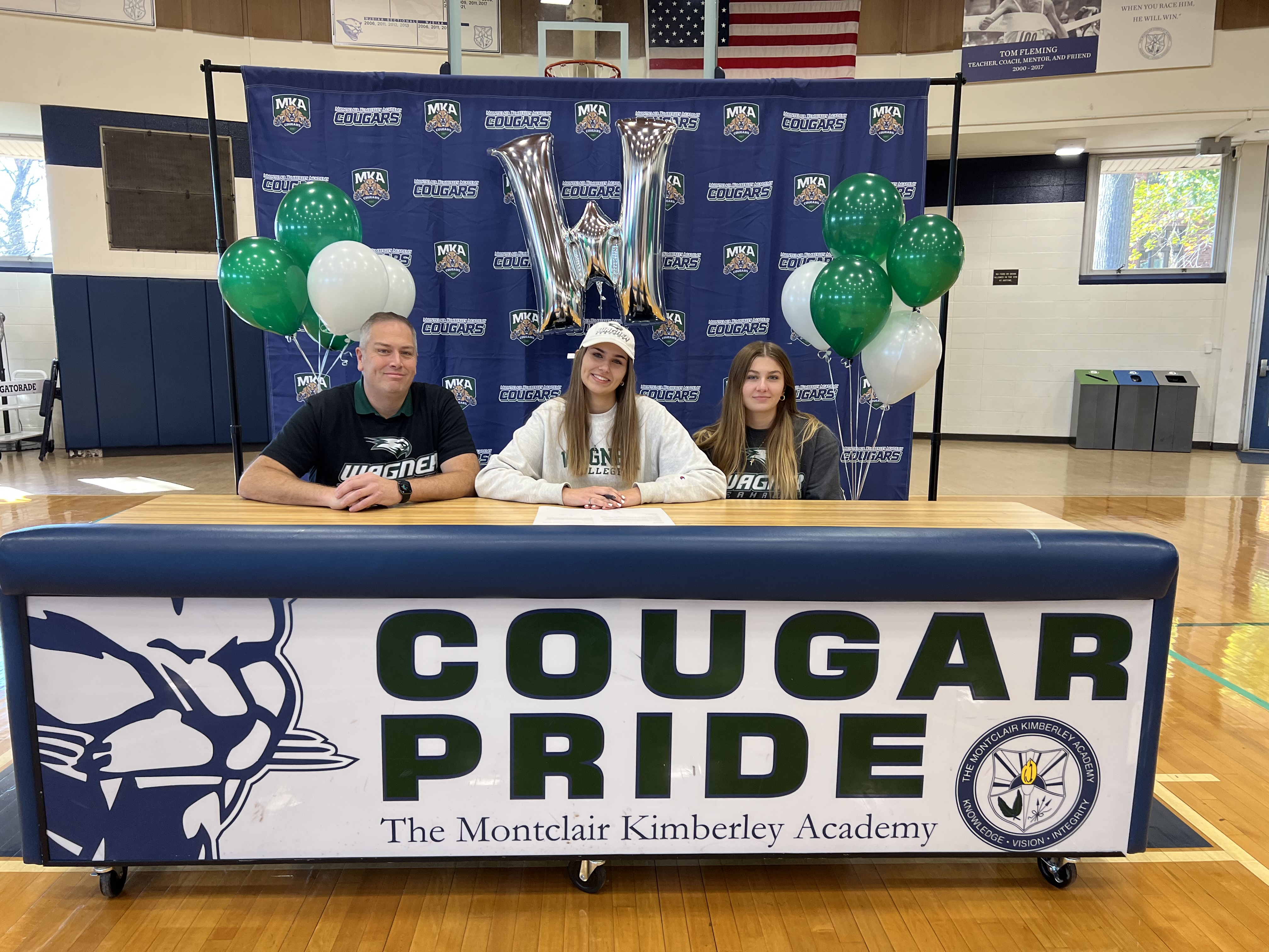 MKA's Alanna Clayton signs her NLI to Wagner fencing with her family.