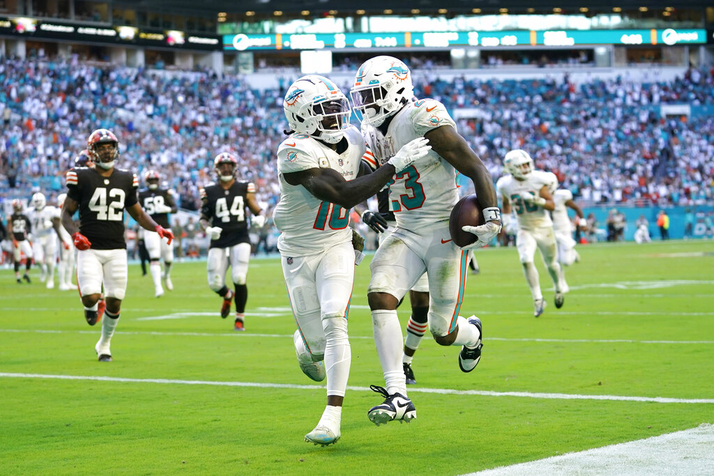 Jeff Wilson Jr. of the Miami Dolphins celebrates with Raheem Mostert after  scoring a touchdown in the second quarter of the game against the Green Bay  Packers at Hard Rock Stadium on