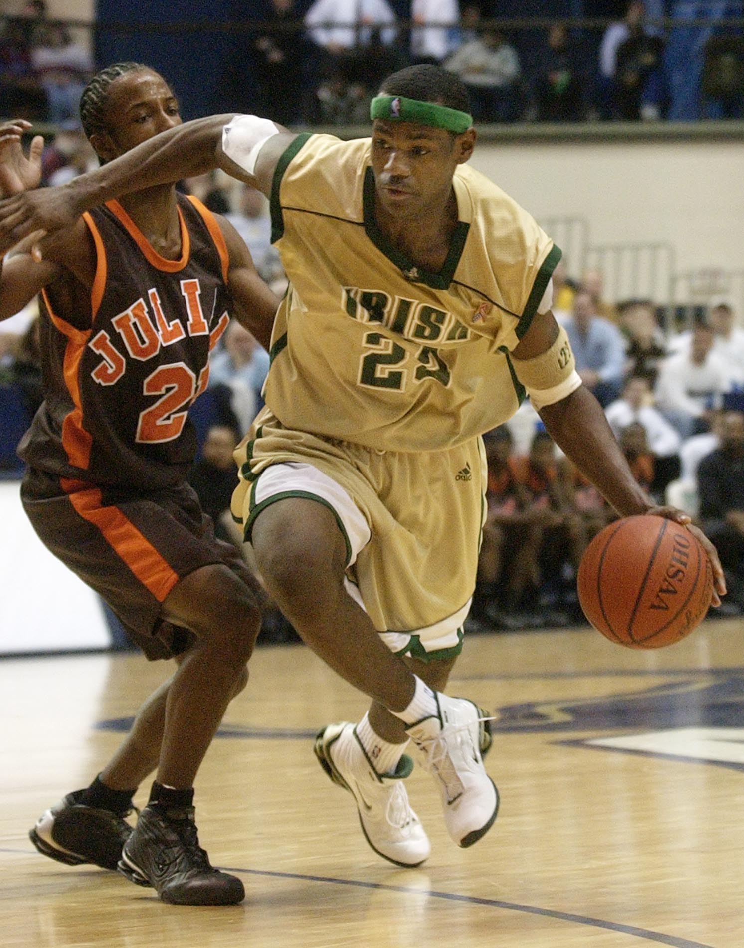 St. Vincent-St. Mary forward LeBron James (23) drives past Chicago Julian defender Jim Brown during the second half at the University of Akron, Saturday, Dec. 7, 2002. (PHIL LONG/SPECIAL TO THE PLAIN DEALER)