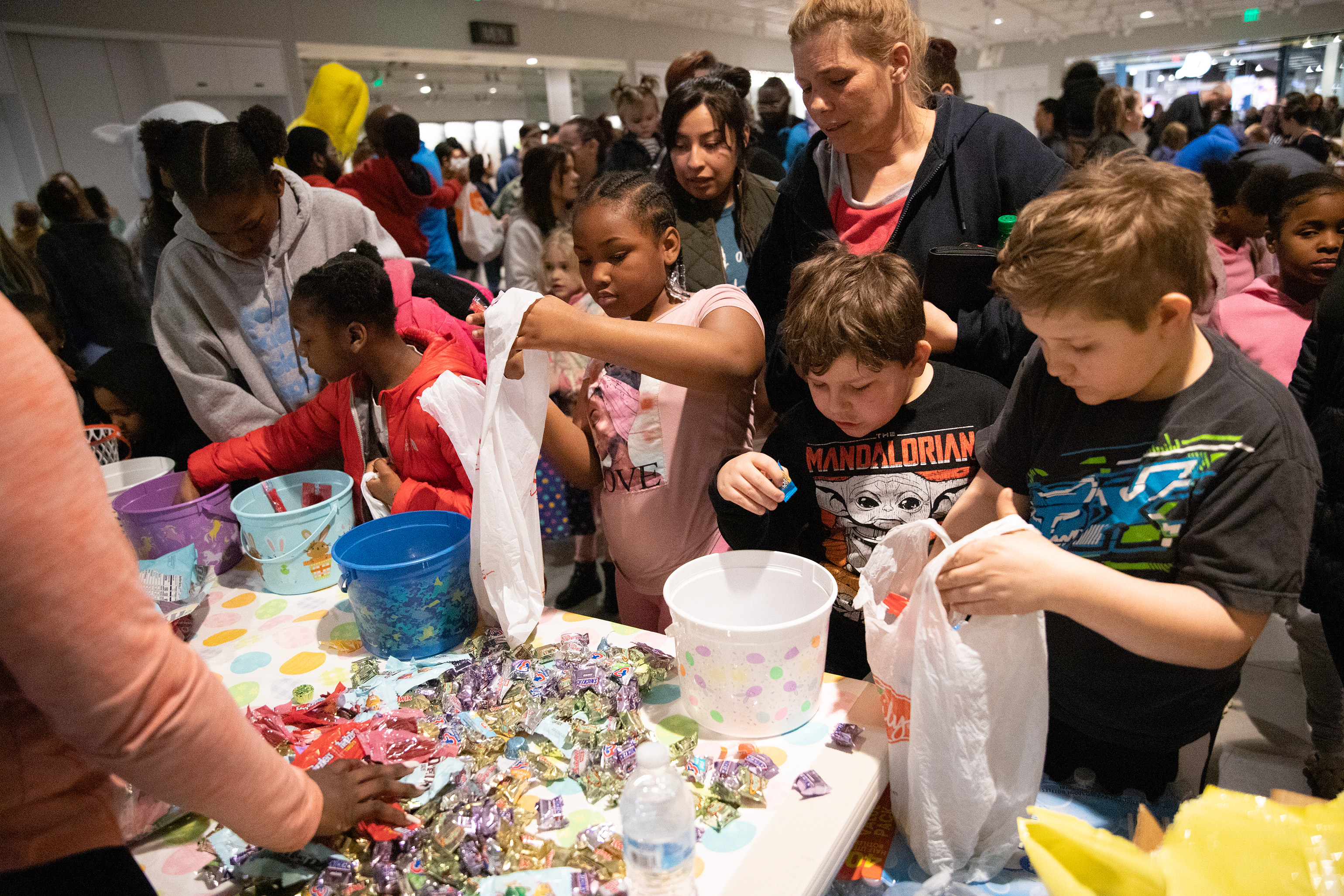 Kids stuff pockets with candy at Egg Hunt Eggstravaganza, News