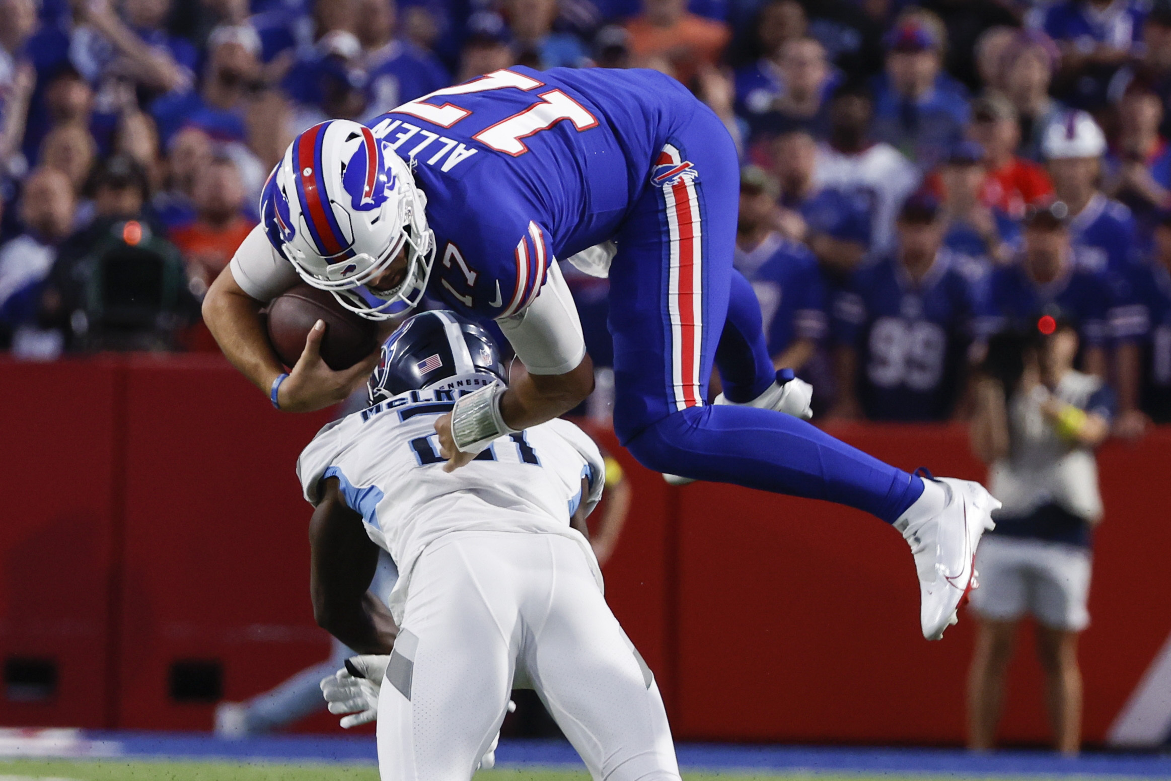 Tennessee Titans cornerback Caleb Farley (3) attempts to tackle Buffalo  Bills wide receiver Stefon Diggs (14) during an NFL football game, Monday,  Sept. 19, 2022, in Orchard Park, N.Y. (AP Photo/Kirk Irwin