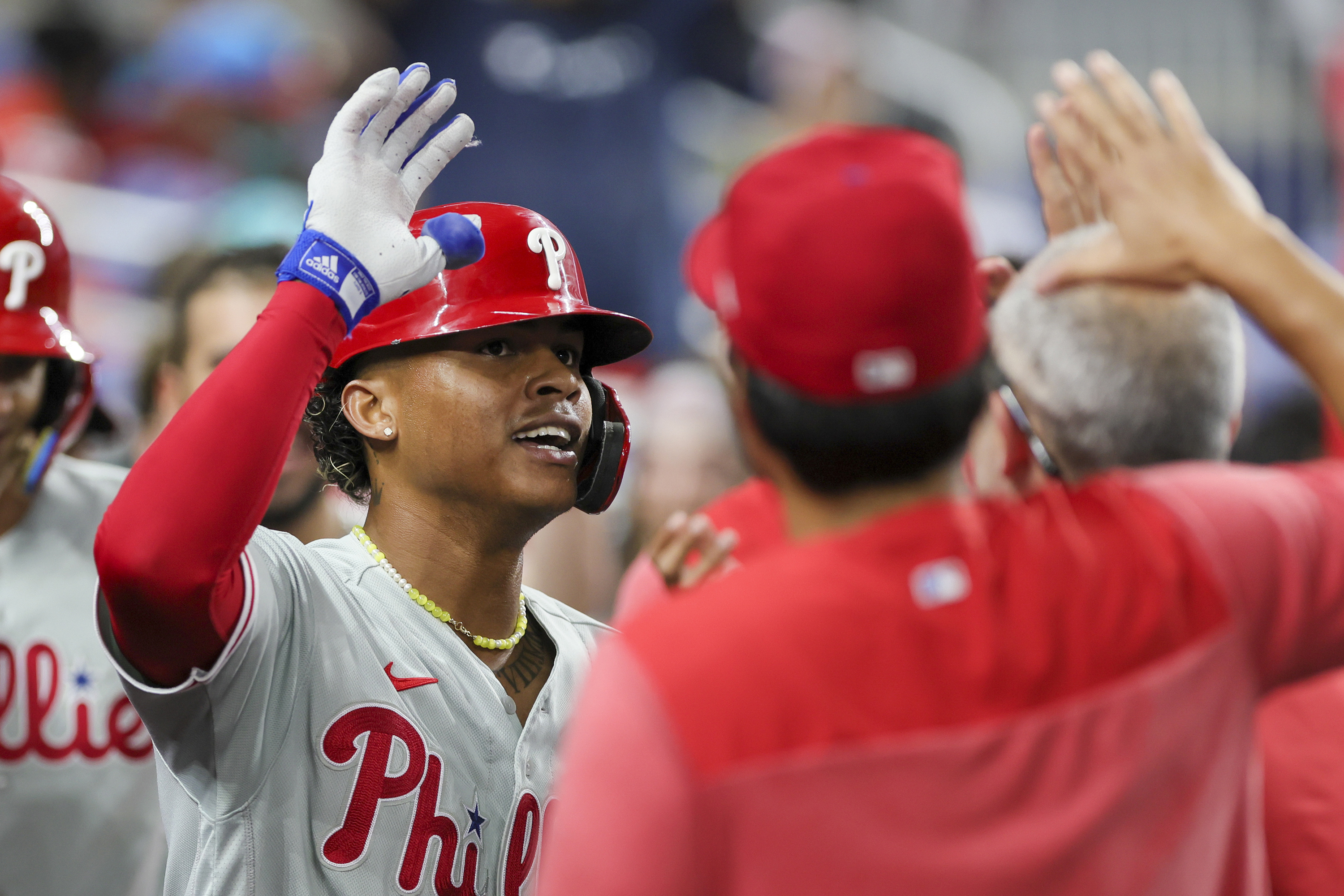 Philadelphia Phillies' Cristian Pache, right, celebrates his RBI