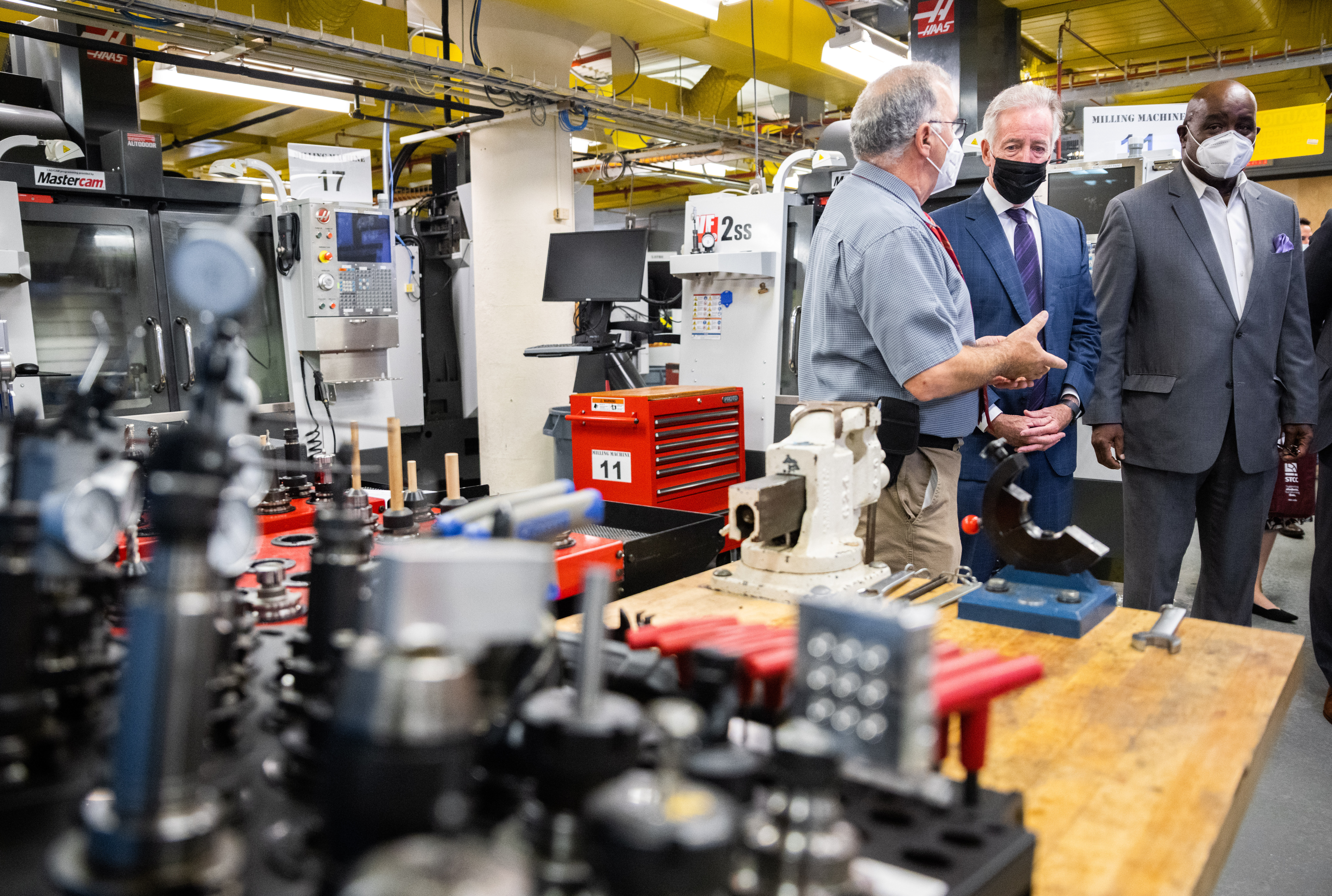 John LaFrancis, Mechanical Engineering Technology professor at Springfield Technical Community College, left, gives a tour of the machine shop to U.S. Rep Richard E. Neal, center, and State Rep. Bud Williams, right, on Thursday, Oct. 6, 2021. (Hoang ‘Leon’ Nguyen / The Republican)